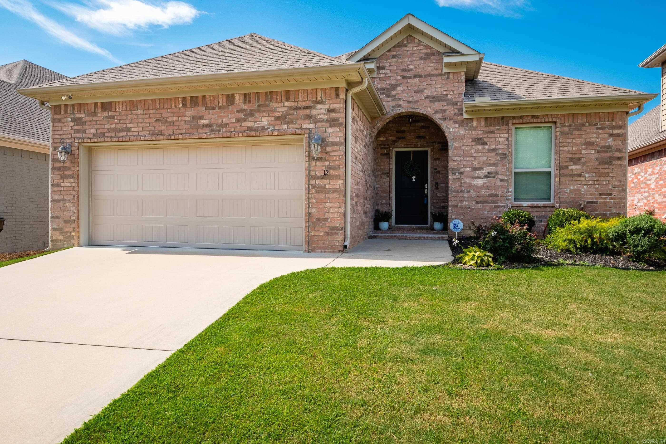 Nestled in the serene, level Valley Ranch subdivision in west Little Rock, this beautifully maintained brick home (2015) offers modern comfort in a peaceful setting. Step inside to discover soaring high ceilings, gleaming hardwood floors, and a spacious living area anchored by a cozy gas-log fireplace ā perfect for gathering or entertaining. The open-concept kitchen showcases striking granite countertops, abundant cabinetry, and seamless flow into the living space. The generously sized primary suite is a private retreat, featuring a luxurious en-suite bathroom with separate tub and walk-in shower, plus a generous walk-in closet. Outside, unwind on the covered porch overlooking a privacy-fenced backyard ā ideal for relaxing evenings or weekend grilling.Valley Ranch is known for its peace and convenience ā itās one of the few newer subdivisions in the area with top-rated schools, nearby recreation, and easy access to Little Rock amenities. This home's open layout and high-end finishes create an ideal low-maintenance lifestyle without compromise.