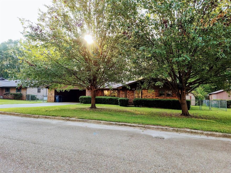 This cozy home in the Berg Addition is ready for you to make it your own.  With a large fenced in yard, this house offers a double carprt with storage rooms, and a separate storage building.  The home has a large den, family room, and a formal dining room with French Doors that lead to the beautiful back yard.  Three bedrooms and two bathrooms to accomodate your family.    Call Century 21 Campbell & Company to view this home at (870) 837-2121.      Square footage, year built, and lot size taken from courthouse records.