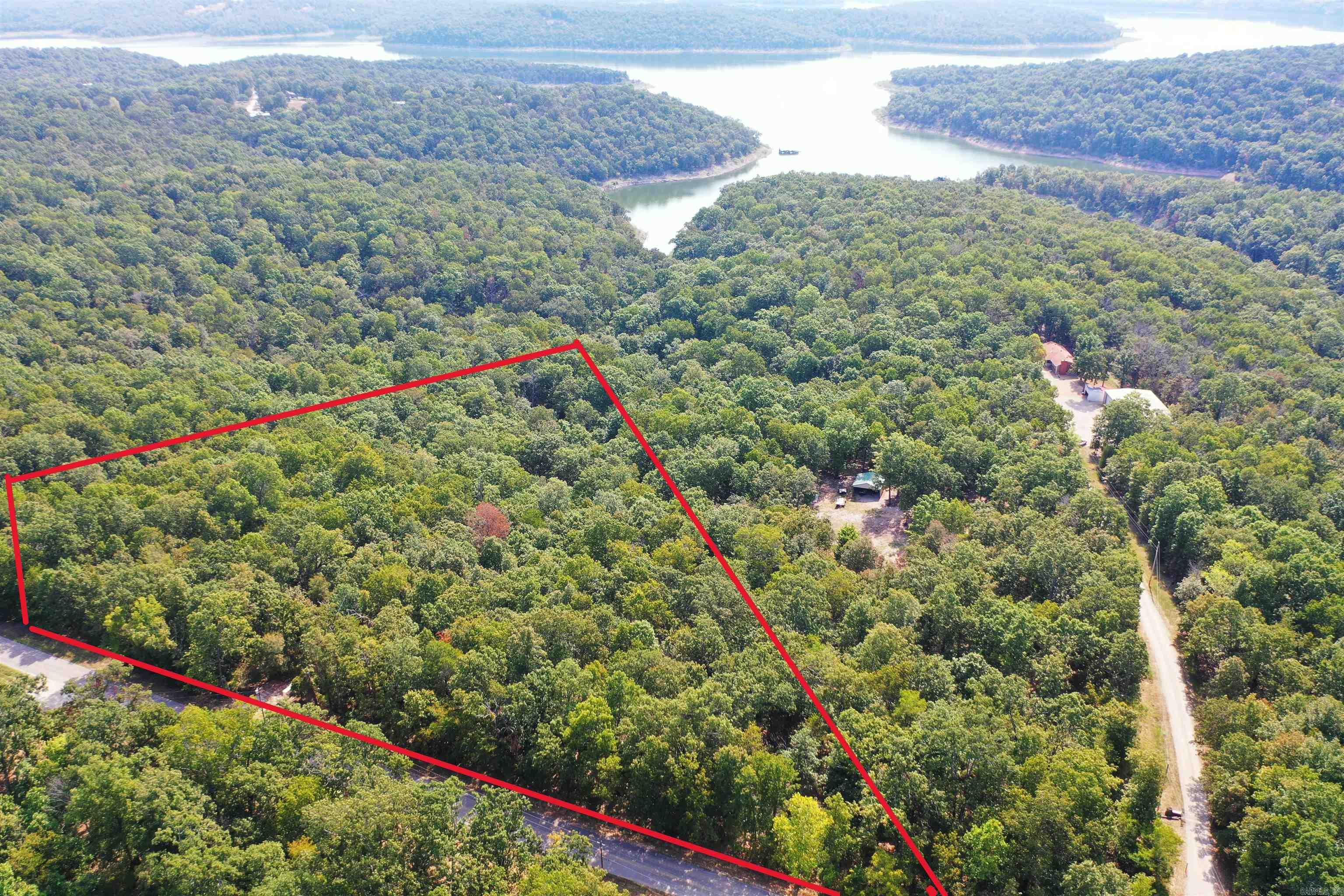 11.2 AC m/l Estate Lot bordering Corps land on Lake Norfork. A nature lovers dream with abundant wildlife to include deer ,turkey, eagles, and more. Domestic water line, sized for fire protection, available in roadway. High speed internet available. Property has had preliminary soil testing for septic system. Paved county road frontage which dead ends at lake. Lots sit well above lake, and well above the Corps flood zone. Protective covenants in place. Possible lake view with some clearing. Less than 10 minutes to Tracy Marina; 15 minutes to downtown Mountain Home.
