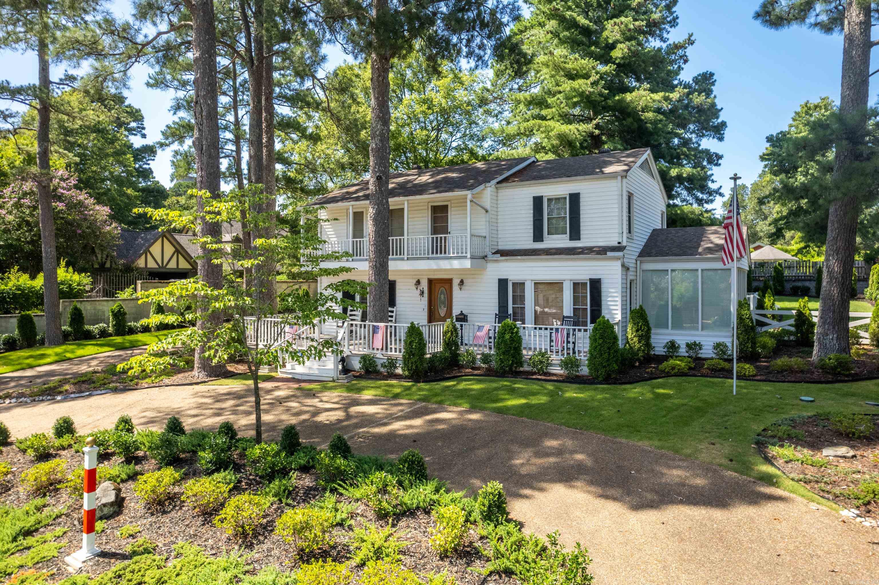 Historic 4?bed, 3½?bath home in Trivista—just steps from Oaklawn Park! Built in 1941, this charming residence offers ~2,600?sq?ft with two fireplaces, two living rooms, formal dining, and a light-filled sunroom. Updated kitchen and bathrooms, hardwood floors, built-ins, and modern heating/cooling deliver both character and comfort. Enjoy morning coffees or race-day views from the expansive front porch and deck. Professionally landscaped on a level lot with a two-car garage. A few minutes drive to downtown, Bathhouse Row, and Oaklawn—ideal for family living or a vacation getaway.