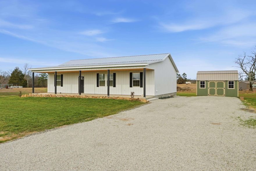 Brand new construction on a full acre in Heber Springs! This beautiful 1,500 sq ft home offers 3 bedrooms and 2 full baths with an open, split-bedroom floor plan designed for both comfort and style. Luxury vinyl plank flooring flows throughout the home, paired with granite countertops that match seamlessly in the kitchen and bathrooms for a cohesive, upscale look. The vaulted ceiling adds an airy, spacious feel to the main living area, while thoughtful design touches elevate this home above standard new builds. The kitchen opens to the living and dining space—perfect for entertaining or everyday living. Step outside to enjoy a flat, usable one-acre lot with a covered back porch, ideal for grilling, relaxing, or taking in the peaceful surroundings. A storage building provides extra space for tools or hobbies, and a carport will be added for convenient covered parking. With modern finishes, functional design, and plenty of outdoor space, this move-in-ready home offers the best of country living just minutes from town.