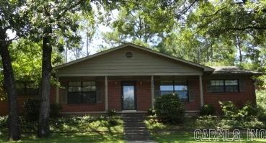 Precious one level brick on corner lot. Three BR/2BA. Wood flooring. Two living areas. Vintage kitchen with good storage.One car carport enters from side street. Laundry area off carport. Small backyard area with chain link fence. Nice shade trees on property.  Good street appeal. Jefferson school district. Priced to sell. With a little TLC this one could be absolutely wonderful. A perfect property for family or investor. Taxes do not reflect homestead tax credit.Easy show.