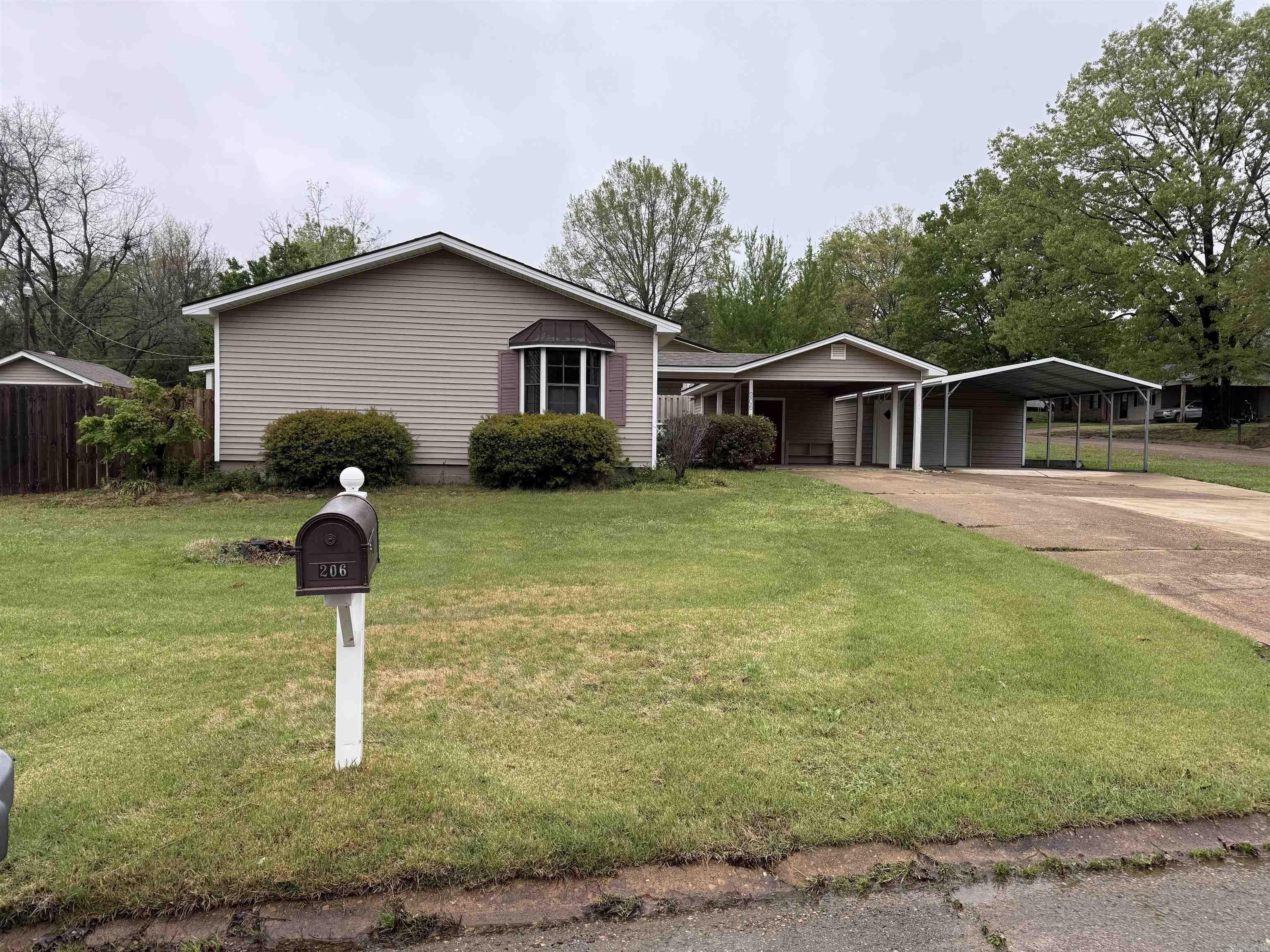 This home is situated on a nice sized corner lot in a quiet neighborhood. The property features a large, fenced backyard with covered patio, perfect for outdoor activities or relaxing. Additionally, there are three storage sheds and covered parking for 3 cars. It is located in a convenient area that is close to the schools. Give me a call to see this in person!