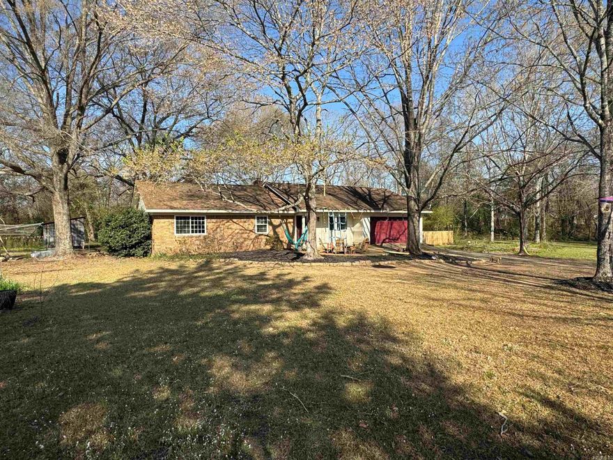 Looking for a little space to spread out RIGHT on the edge of Searcy? This lovely home features a large living room/den with a wood burning fireplace with gas available for logs, AND a lovely family room/sunroom full of natural light, bamboo wood floors in living areas/kitchen & hall way, solid surface kitchen countertops & newer appliances in the kitchen including a gas stove. The hall bath has a double vanity and a nice built-in linen closets for storage. The primary bath has a double vanity as well, as an updated shower and a separate linen closet. The 2x6 walls help keep utilities low. Large backyard with a lovely covered deck for watching the sun set behind the home! Front yard is fenced with a gate so that your little ones or your chickens can roam free! Call today to make this affordable home yours!