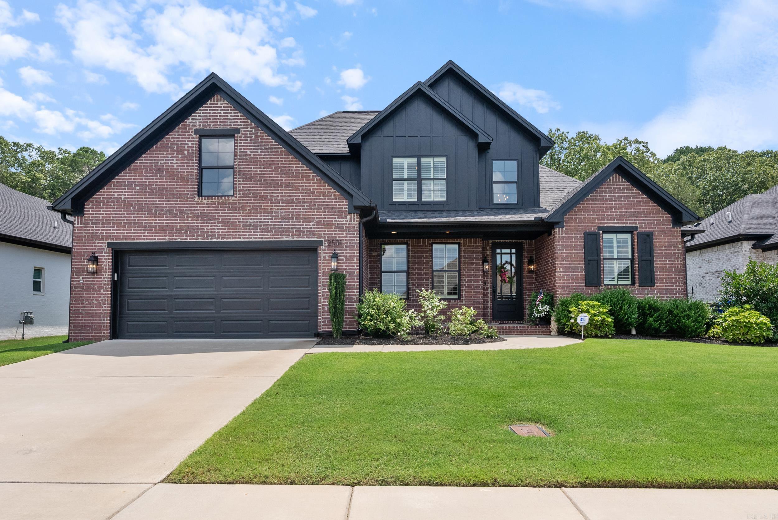 Stunning custom built home with countless upgrades throughout. Beautiful luxury vinyl floors in the living areas and primary bedroom. 18' ceilings with gas fireplace and stunning wood panel accents in the living room. The open floor plan allows for seamless entertaining. The beautiful kitchen features quartz countertops, a quartz backsplash, gas range, and extra cabinet space. The downstairs primary suite has a custom bathroom with curbless shower, dedicated makeup station, and large walk-in closet. Downstairs you will also find a flex room that could be used as a 4th bedroom, office, or kid's play room. There's also a half bath downstairs for guests. Upstairs has two bedrooms with a full bathroom and oversized walk-in closet off of the front bedroom. Additional features include: Upgraded kitchen appliances, brick accent wall in flex room, upgraded lighting, plantation shutters throughout home, and much more. The exterior of the home features a screened-in porch wired for t.v., underground drainage, sprinkler system that covers the entire lawn, and a concrete patio perfect for grilling. Great location with easy access to UCA, dining, shopping, and I-40.