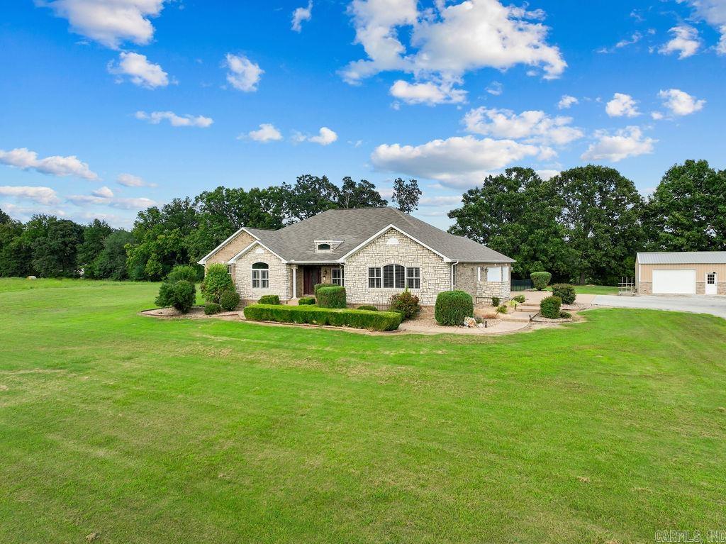 STUNNING CUSTOM-BUILT STONE & BRICK HOME ON 2.08 ACRES M/L. Your dream home nestled on 2.08 acre lot m/l just outside of Gassville w/a blend of luxury, comfort & convenience. Easy access to the renowned White River & Bull Shoals Lake, this property is an ideal haven for fishing enthusiasts & nature lovers alike. Gourmet kitchen in heart of the home boasts of spacious kitchen equipment w/beautiful granite countertops, a gas cook-top w/a convenient pot filler, and an expansive walk-in pantry. Living room features soaring vaulted ceilings & a cozy gas fireplace. Large windows overlook the fenced backyard & patio. Master suite features lg walk-in closet, lg jetted tub, The property includes a 30x40 drive-thru boat shop. The home is equipped w/a whole-house generator, security system for peace of mind. Plantation shutters through-out the home add an elegant touch. Luxury living in a serene, natural setting. Don't miss the opportunity to make this home yours! Contact us today for a showing.