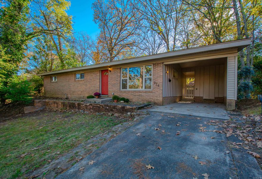 Adorable Park Hill home within 4 blocks for Lake number 1. A mid century modern feel with huge living room windows gives a light an airy feel. Newly restored hardwood flooring. Vintage tile in the bathrooms with a large laundry room for additional storage off the galley kitchen. 3rd bedroom has built ins for a nice office or bedroom. The huge back yard with area for a nice garden and more. The stone patio off the back of the house is lovely and has a nice concrete drainage system. Newer windows, plumbing and electrical were updated in the last 15 years. New roof 2023. One car carport and parking pad. No disclosure, sold as is.  See agents remarks.