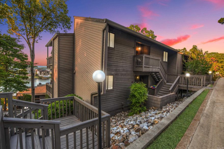 Enjoy stunning lake views from this well-maintained upper-level, end-unit condo in the sought-after Southshore community, located in Hot Springs’ highly desired “7 South” area. Perfect for investors or vacation homeowners, this gated complex is one of the largest and most popular on Lake Hamilton—ideal for short-term rentals. Step inside to a bright, open layout featuring: Two balconies – a spacious one running the length of the back for panoramic lake views, plus a private side balcony Cozy fireplace for cool evenings Updated bathrooms and double closets in both bedrooms Plenty of open parking for you and your guests Recent updates include a new roof (2023) and a Trane HVAC system (2020) for peace of mind. A covered boat slip is included, making lake days effortless. Community amenities: Two swimming pools, tennis court, beautifully landscaped grounds, and gated entry. HOA: $324/month – covers exterior building maintenance, all amenities, landscaping, lawn care, and water for each unit. Whether you’re looking for a lakeside getaway, an income-producing property, or a low-maintenance home in a prime location—this one checks all the boxes.