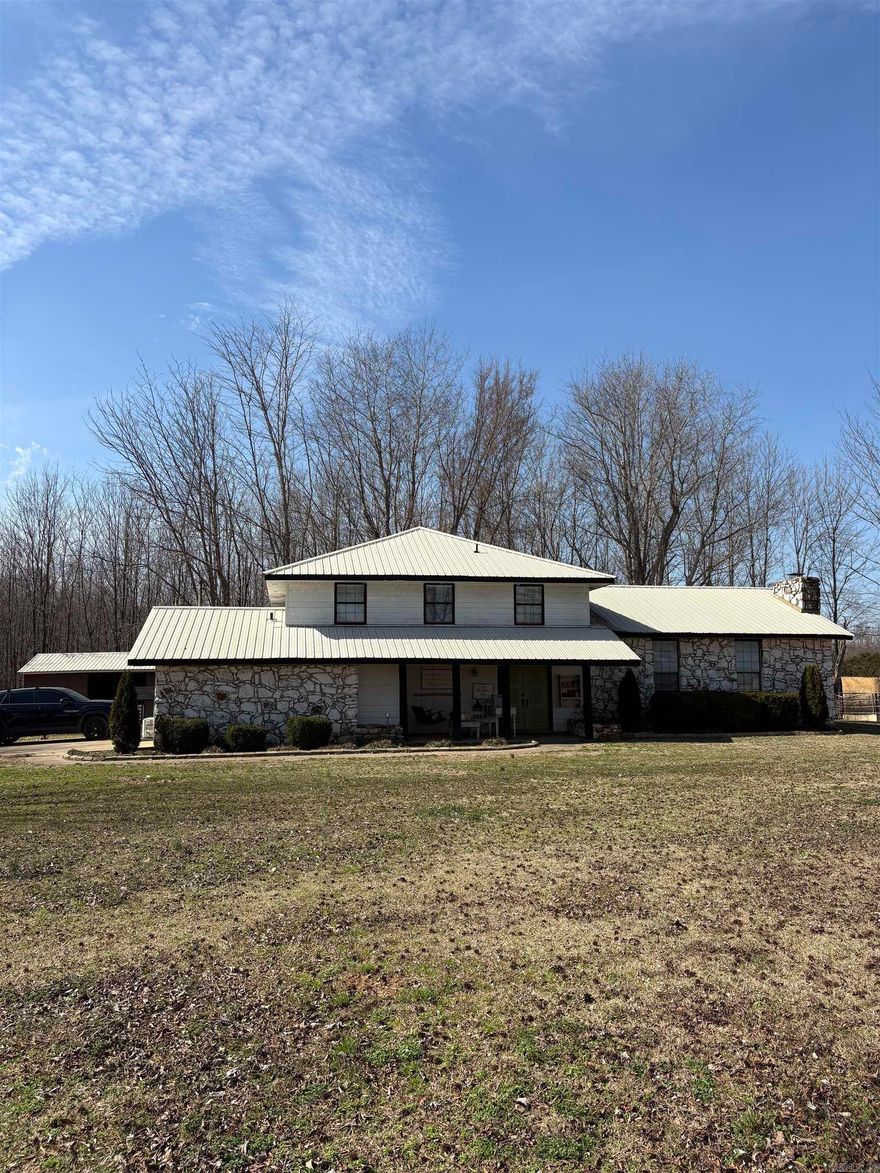 Welcome to this charming country home set on 5 acres of natural beauty, offering privacy, space to roam, and endless possibilities.  Inside you will love the completely remodeled kitchen along with fresh paint and new flooring throughout creating a clean, move-in ready feel. A standout feature is the 475 sq. ft. man cave, created by enclosing the garage and adding a mini-split system for year-round comfort. The property includes a 40x30 barn with durable concrete floors, providing ample space for equipment, storage, or workshop needs. A dedicated corner of the barn houses a chicken coop with its own access door to the yard. It's perfect for those dreaming of fresh eggs and a touch of homestead living.