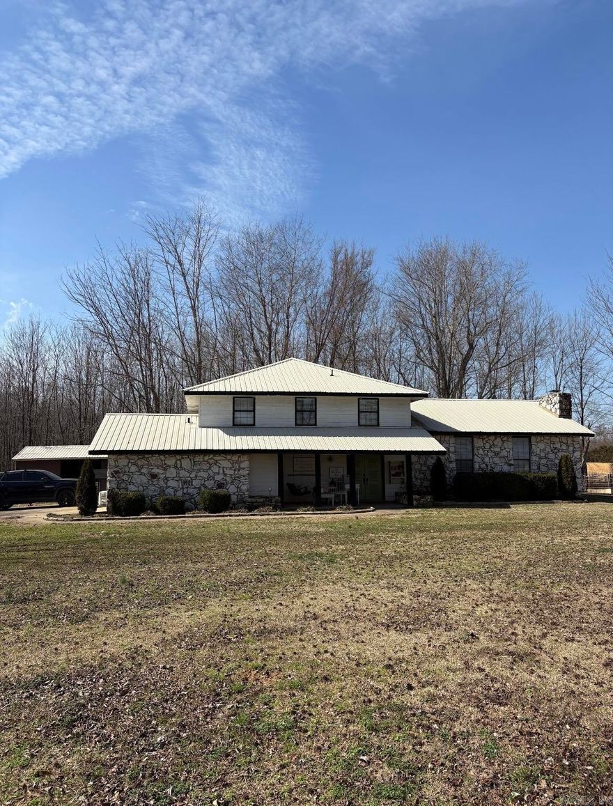 Welcome to this charming country home set on 5 acres of natural beauty, offering privacy, space to roam, and endless possibilities.  Inside you will love the completely remodeled kitchen along with fresh paint and new flooring throughout creating a clean, move-in ready feel. A standout feature is the 475 sq. ft. man cave, created by enclosing the garage and adding a mini-split system for year-round comfort. The property includes a 40x30 barn with durable concrete floors, providing ample space for equipment, storage, or workshop needs. A dedicated corner of the barn houses a chicken coop with its own access door to the yard. It's perfect for those dreaming of fresh eggs and a touch of homestead living.