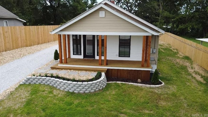 Newly Remodeled Downtown Charmer – 3 Bed, 2 Bath, 1,044 sq ft Step inside this beautifully remodeled 3-bedroom, 2-bath home located just blocks from the heart of Harrison! Featuring an open-concept floor plan with luxury vinyl plank flooring, custom accent lighting, and stunning wood beam ceilings, this home blends modern style with cozy charm. Enjoy a bright and updated kitchen with stainless steel appliances, quartz-look countertops, and white shaker cabinetry. Both bathrooms have been fully renovated with designer fixtures and contemporary finishes. Spacious bedrooms include stylish feature walls and plenty of natural light. Outside, you’ll find a welcoming front porch, a large back deck, fresh landscaping, and a fully fenced yard with wood privacy fencing. Off-street parking and a new gravel drive complete this move-in-ready home. Perfect for first-time buyers, investment, or anyone looking for low-maintenance living with quality updates!