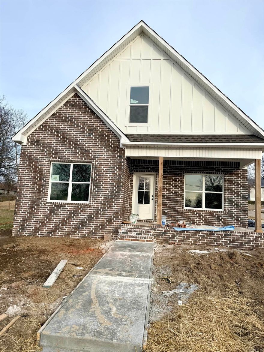 New construction with style and functionality in a prime location! This thoughtfully designed home features a main-level primary suite with dual sinks and a spacious layout. The open living, kitchen, and dining area is perfect for entertaining, highlighted by a large island with breakfast bar seating. You’ll also love the oversized laundry room and convenient mudroom area. Upstairs offers two additional bedrooms and a full bath. Granite countertops and durable LVP flooring run throughout the home for a cohesive, low-maintenance finish. Step outside and enjoy direct access to the 8-mile walking trail right in front of the home! (Tax amount reflects land only.)