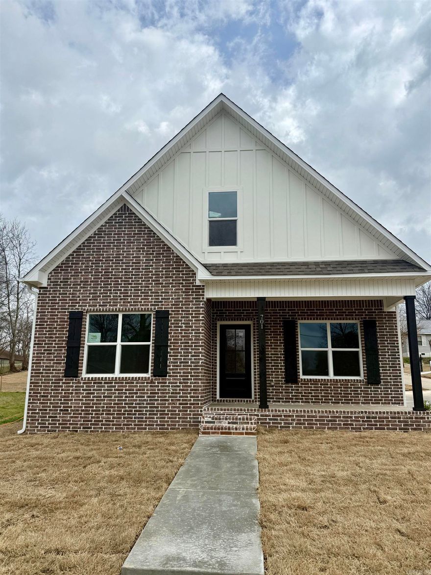 New construction with style and functionality in a prime location! This thoughtfully designed home features a main-level primary suite with dual sinks and a spacious layout. The open living, kitchen, and dining area is perfect for entertaining, highlighted by a large island with breakfast bar seating. You’ll also love the oversized laundry room and convenient mudroom area. Upstairs offers two additional bedrooms and a full bath. Granite countertops and durable LVP flooring run throughout the home for a cohesive, low-maintenance finish. Step outside and enjoy direct access to the 8-mile walking trail right in front of the home! (Tax amount reflects land only.)