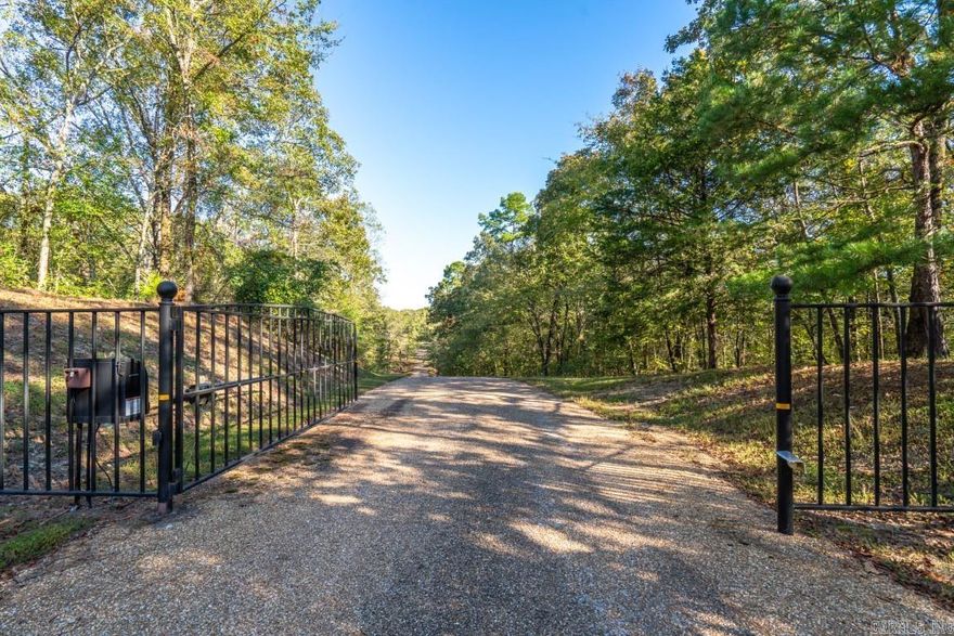 Seeking rural living in a private, gated subdivision? S K Trail is located where Hot Springs meets Royal. This unique building site offers the security and building conveniences of a planned subdivision with the privacy only afforded by owning acreage. Entergy and City Water are available along S K Trail. The property has been perk tested and has permits in place for both septic and stormwater. Build your dream home surrounded by mature trees in this beautiful natural setting. Copies of the survey and permits are also available for review. This plat is approved for one site-built, single family home with a minimum square footage of 1,600 sqft.