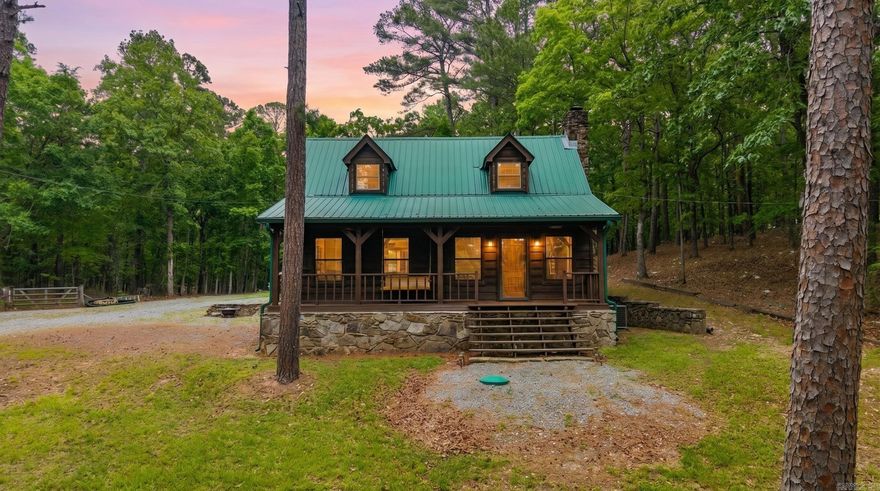 Tucked away near Lake Norrell, this property is the perfect getaway. Whether you want privacy, the ability to hunt deer and turkey, or a generous acreage and cottage near the lake, this has it all! Set on 9.83 acres, there is flat grassland, along with rolling hills and exposed quartz throughout.  It is truly exceptional! Welcoming front porch overlooks shaded, oversize front yard.  Walk inside to vaulted ceilings in a rustic living space, complete with hardwood floors and a woodburning stove. The remodeled kitchen is quaint with updated appliances.  Primary bedroom and bath down with a loft upstairs. Charm throughout! Lots of updates including new electric, all new paint, new windows, new exterior stain, new decking and drainage around the garage, new gutters, new gravel driveway, professional landscape, trees cleared, new well components and water testing, deer stands and feeders added + so much more!  Truly unique and one-of-a-kind! Come see today!