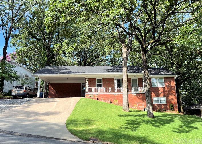 Talk about Midtown convenience! Walk to Chick-fil-A, Target, Park Plaza & more! Lovely updates by Owner includes remodeled kitchen with new cabinets/quartz counters, new vinyl windows, refinished baths & hardwoods, New Roof in 2024 and much more in this 1960's floorplan that has been "opened up" to enjoy the company of friends ... Spacious Dining opens to Kitchen & Living room * Separate Laundry room * 680 sq.ft. Downstairs has its own kitchenette & Bath/Laundry ... could be the master suite ... or ideal for grown children/extended family ... or Airbnb - supplement your income with separate rear entrance & extra parking pad with this efficiency apartment * You will absolutely fall in love with this home and it's location * Crawlspace is encapsulated ... no mold or mildew here - Great Workshop space for Dad's stuff * Appraisers see agent comments