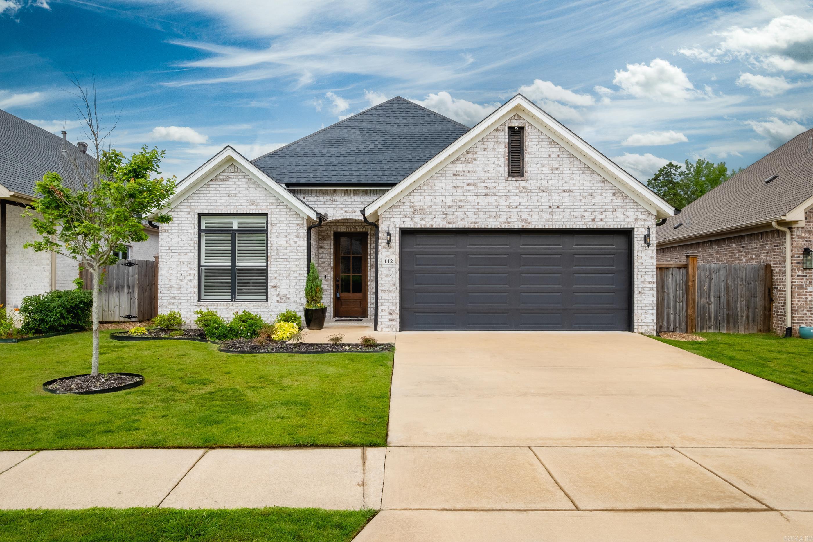 Impeccably maintained in Parkside Place! Upon entering you're greeted with soaring ceilings and a grand entryway leading into the open kitchen and living area with high end touches throughout. Tons of natural light cascades through large windows and French doors leading to covered patio perfect for entertaining with mounted TV, and natural gas line ran for grilling. Wonderfully low maintenance home with brick exterior, front and back sprinkler system, tankless hot water heater, energy efficient HVAC with built in humidifier, smart thermostat, and weekly lawn care included in the HOA. Move-In Ready!