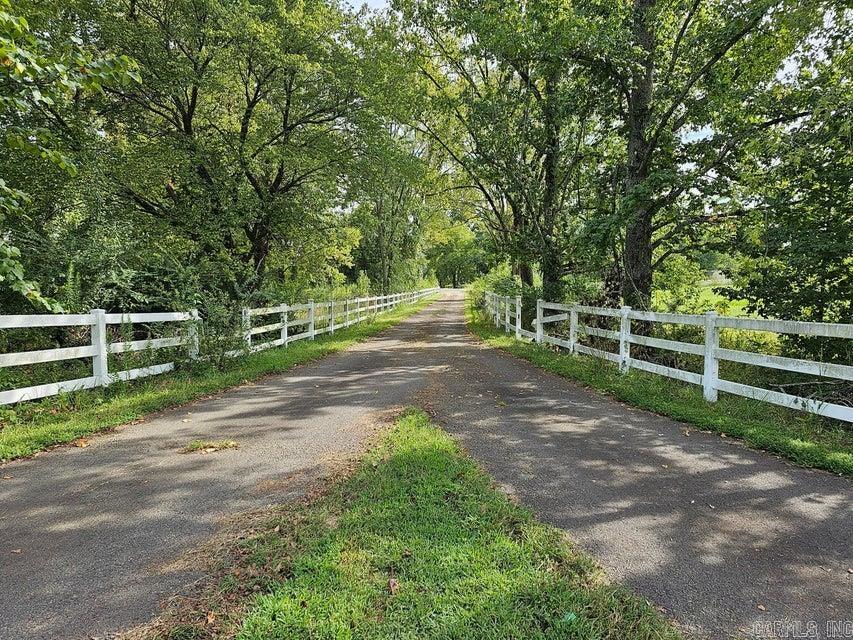 **Motivated Sellers!!** Welcome to this exceptional opportunity to own 27 acres of prime property located just outside of Dardanelle, past Walmart. This stunning piece of land offers endless possibilities, whether you are looking to build your dream home or seeking an investment property for your next adventure. Nestled in a desirable location, this property boasts a picturesque setting that is surrounded by natural beauty. With its expansive 27-acre size, you'll have plenty of space to bring your vision to life. Imagine waking up to breathtaking views and enjoying the tranquility of your own private oasis. The convenience of this location cannot be overstated. Situated just a short distance from Walmart, you'll have easy access to shopping, dining, and other amenities. Despite its proximity to these conveniences, the property maintains a peaceful ambiance, offering the best of both worlds. Please note that the house on the property is not for sale. We kindly request that you do not drive in front of the home. To ensure the utmost privacy and security, viewings are by appointment only.