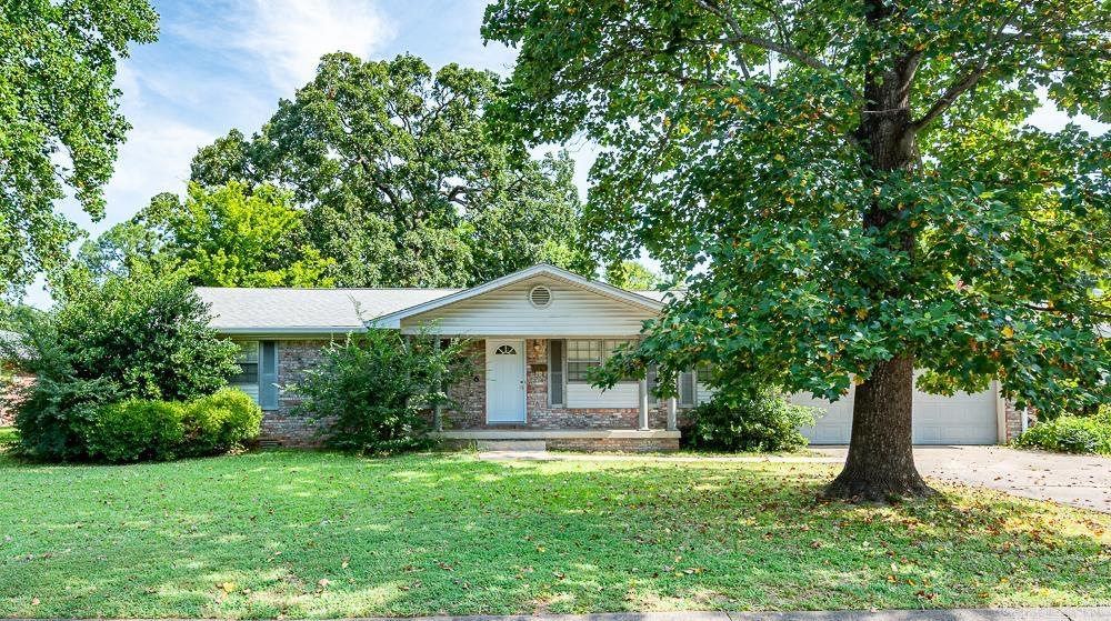 Located in a quiet neighborhood on level lot with mature trees this all brick home boasts spacious rooms and an easy floor plan. 2 large living areas with new fixtures plus some canned lights - family room with WBFP (chimney recently cleaned). 3 bedrooms with 2 full baths. The eat-in kitchen with granite counters features tons of cabinet space, a handy pantry, refrigerator that stays and a microwave. Laundry space adjacent to kitchen with washer and dryer that stay. Newer deck overlooks pretty backyard. New HVAC. 2 car garage. Current home warranty is transferable.