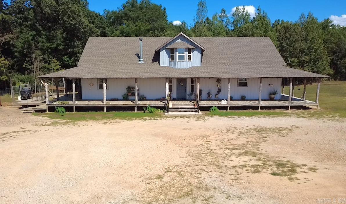 LISTED BELOW APPRAISAL! MOTIVATED SELLER. 3 acres located outside the town of Cove. Featuring this 3200 sq ft 4-bedroom, 3 bath home built in 2022. Granite countertops, beautiful wood floors & ceramic tile throughout. White Oak staircase to second floor. Wood burning stove for backup heat. Amazing wrap around porch with decks, could be great for Saturday morning coffee sipping or enjoying your evening cooking out with family & friends. Vapor barrier & lights installed in crawlspace under home. New 26x24 chicken coop. 12x20 storage building. Two RV hookup combination boxes containing 110, 30 & 50 amps, each having own Water & Sewer. 32'x110' Metal Shop with 16 ft sidewalls, concrete floor & foam insulation from ground to peak. Septic is available to shop. Over 1000' Highway 71 frontage. Great business opportunity!