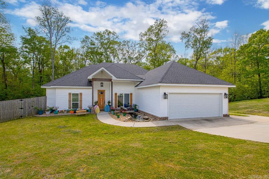 Welcome to 2065 Berkshire Dr in Crossroads Village, where country living meets suburban convenience. Nestled in a peaceful cul-de-sac, this home offers serene views of woods, deer, and birds without compromising on proximity to amenities. (Less than 5 miles from future Buc-ee's, Chuey's, Longhorn Steakhouse and more to come)   Step inside to discover an inviting open floor plan that seamlessly integrates the living room, complete with a cozy woodburning fireplace, a spacious kitchen, and a dining area, all with panoramic views of the huge backyard.  To the left, you'll find two guest bedrooms connected by a Jack and Jill bathroom, accessible from both the living area and bedrooms. On the right side, an expansive primary bedroom awaits, featuring direct access to the back porch for tranquil mornings. The ensuite bathroom boasts a tiled shower, a luxurious soaker tub, and dual vanities, leading seamlessly into a large walk-in closet with convenient access to the laundry room.  Additional highlights include a private office situated at the front of the house, adjacent to the living room.  Roof, HVAC system, and water heater, all installed in 2019 and meticulously maintained.