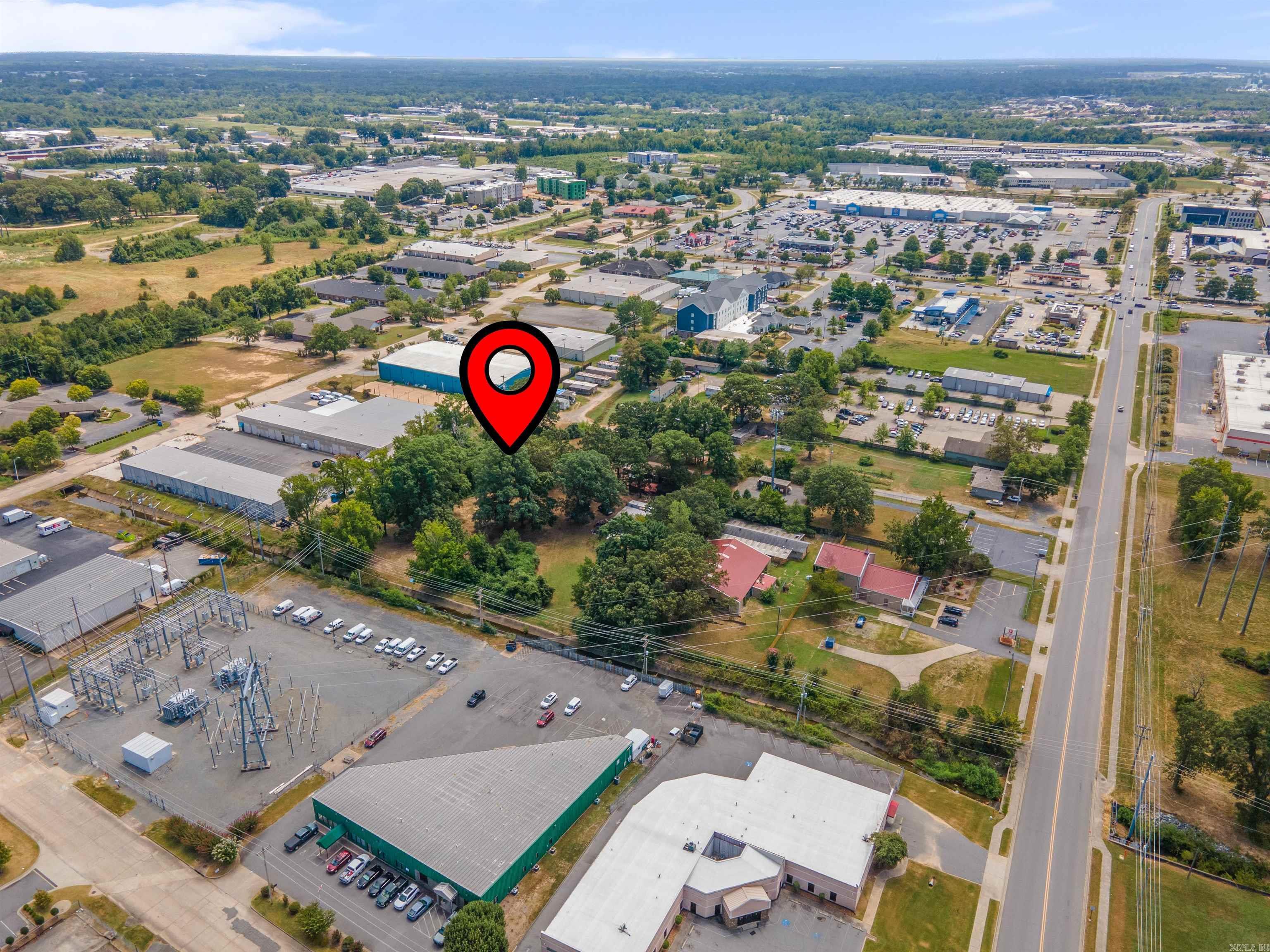 ACREAGE IN THE CITY!!?? Say no more, and look no further! LOCATION, LOCATION, LOCATION!! Just over 2.3 acres right off McCain and behind Home Depot! The land is flat, and very well maintained! There is also a 3 bedroom, 2 bath home with a new, large deck off the back! This could be your personal home while you build your business next door, or could make an excellent office building - ENDLESS POSSIBILITIES! SCHEDULE A SHOWING TODAY!