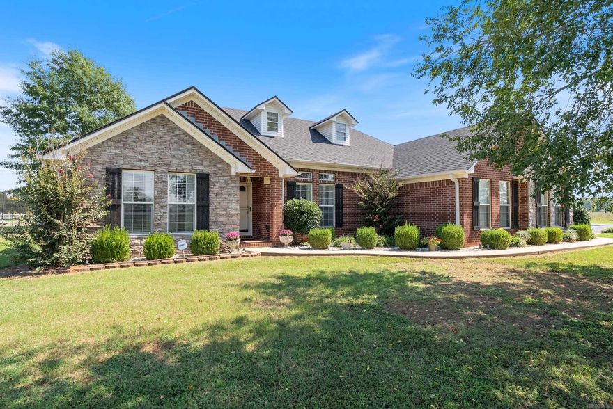 63 Sharon Road in beautiful Vilonia, Arkansas is a dream come true for anyone seeking both space and comfort. This stunning property spans over 10 acres and features not one, but two ponds—perfect for relaxing afternoons or weekend get-togethers! The heart of this home is its spacious 1900 square-foot layout, boasting three cozy bedrooms and two modern bathrooms. You'll love the gorgeous granite countertops in the kitchen. Outside, the property is cross-fenced and comes complete with a charming white picket fence, adding to its appeal. Whether you're looking to enjoy the well water for outdoor use or the convenience of city water for indoor needs, this home offers the best of both worlds. For those who love to tinker or need extra storage, there's a shop on the property that can accommodate all your tools, hobbies, or even serve as a workspace That is not all, this property also has a barn. Plus, you’ll appreciate the added safety of a storm cellar and the many updates throughout the property. Don’t miss this opportunity to own a slice of Arkansas paradise!