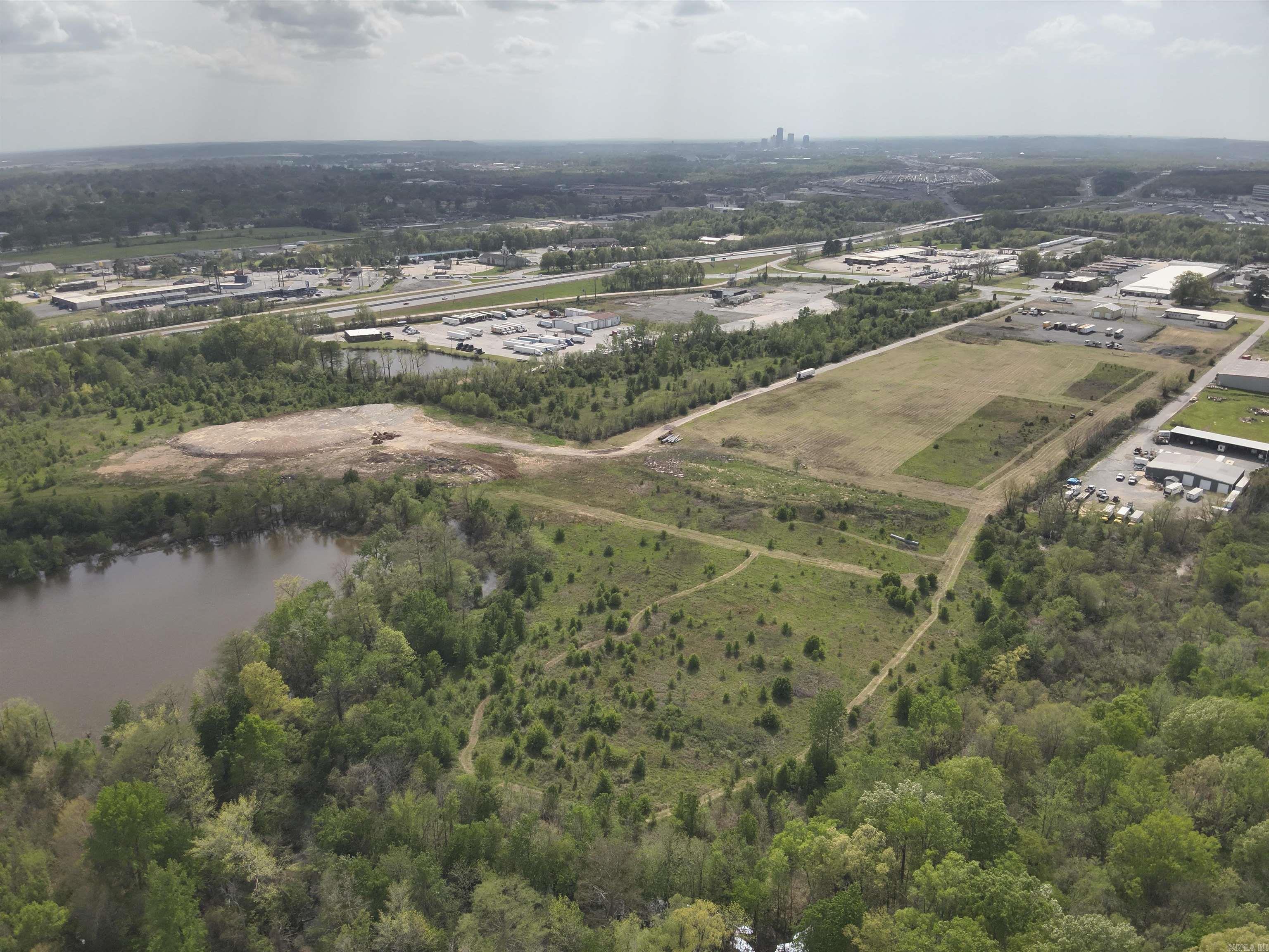 Exciting industrial opportunity with 48 acres zoned C3 and I2 industrial in North Little Rock. Has expansive office over 14000 sq feet with multiple restrooms offices breakrooms and conference rooms. Large shop with industrial fencing. The land has been mostly developed for a large industrial complex. You will have a presence from I40 and can be viewed from the millions of travelers using the main interstate coming through our great state. Frontage on Highway 161 with multiple large business's surrounding this great property.