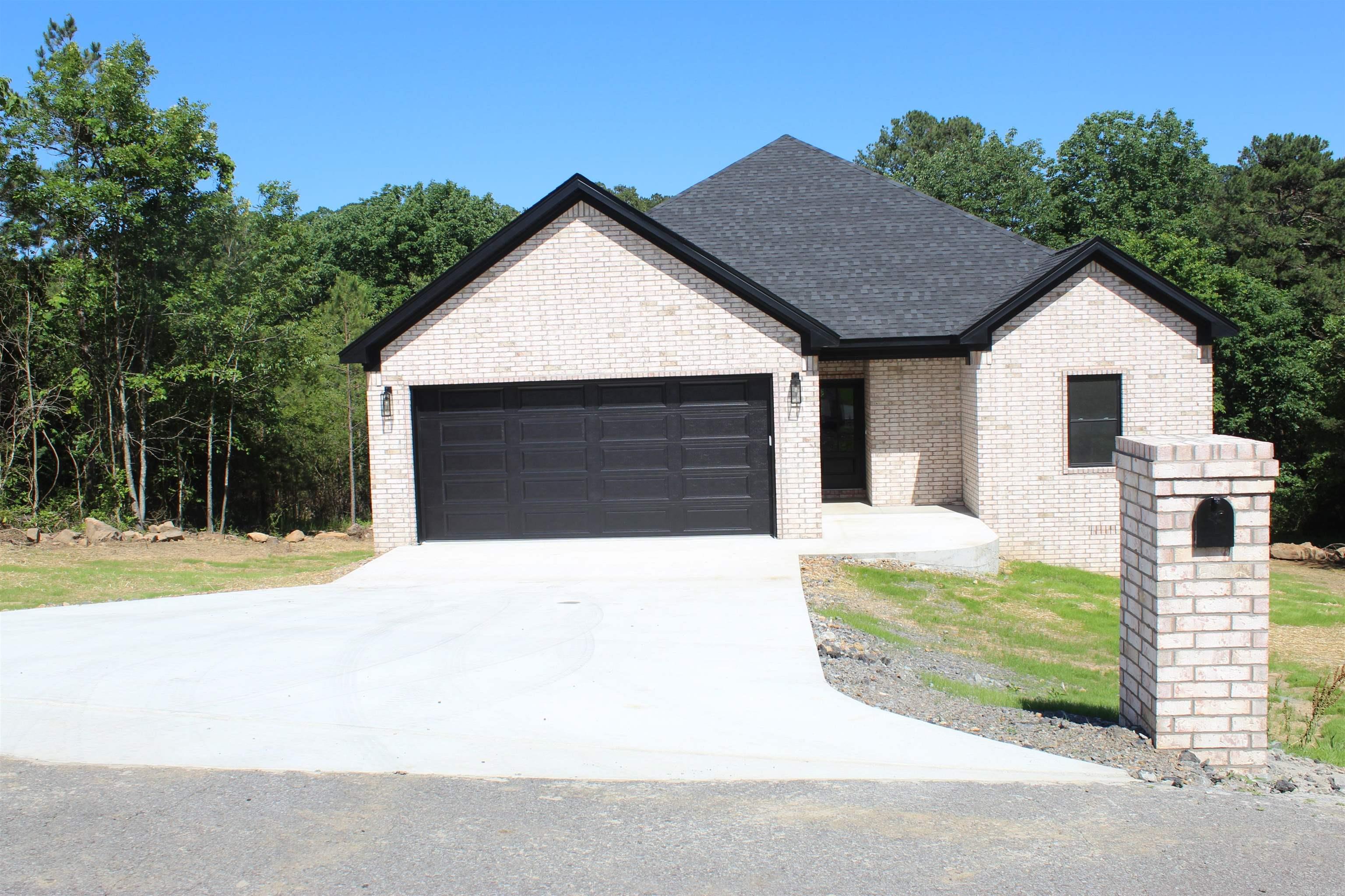 Located near end of cul-de-sac, beautifully built 3 bed 2 bath brick home that is minutes to Greers Ferry Lake, Little Red River, and everything that Heber Springs has to offer. Kitchen features Quartz countertops, easy shut drawers and cabinets, pull out drawers for cabinets, vaulted pine wood ceiling in the living room, large covered back deck, and 2 car garage. Split floor plan with main bedroom having 2 closets situated near the garage entrance and laundry room. This home has so much to offer.