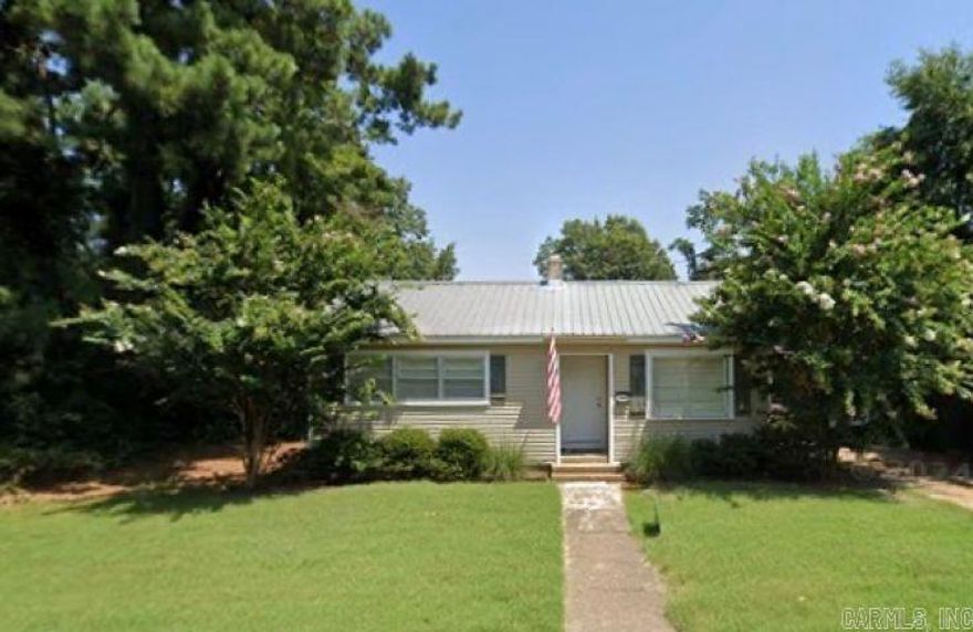 Cozy Home on Forrest Ave E  --  Discover comfort and convenience in this charming 2 bedroom, 1 bath home, close to schools, churches and community amenities.  Perfect as a starter home or a smart investor-friendly property, this home offers practical features and easy living.  A durable metal roof provides long-term peace of mind, while the bathroom includes a tile-surround tub/shower combination for a clean, updated look.  Outside, the property features a concrete driveway and a 2-car portable carport offering ample covered parking plus a beautiful magnolia tree.  With its central location and solid features, this home is an excellent opportunity for homeowners and investors alike.  Don't miss your chance to make it yours! Washer, dryer, refrigerator, microwave and screen will remain.  A moisture barrier and automatic vents have recently been installed in the crawl space.