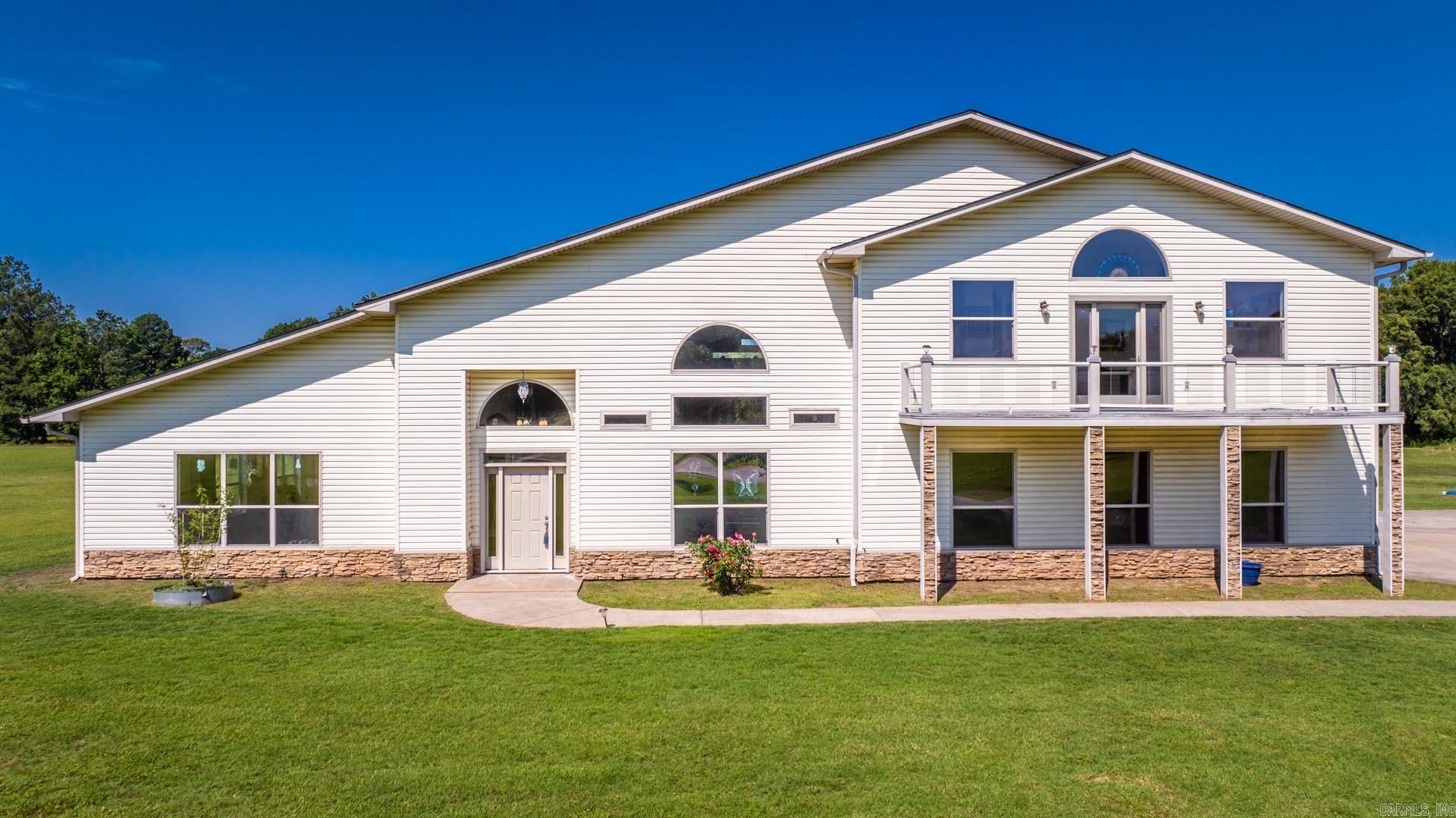 Stunning custom home, approx. 5,600 sqft, on 4+/- acres with 3-5 BR, 2.5 BA, plus a 2,500 sqft shop/garage perfect for a mother-in-law suite or rental with minimal finish-out. Private yet only 25 minutes from downtown and the airport, offering the perfect blend of seclusion and convenience. Spacious layout, upscale finishes, and 2023 updates including an architectural roof, gutters, solar power system (25-year warranty), and a 22kw whole-house generator (7-year warranty). Extras include a workout room with walk-in shower. Luxury, functionality, and sustainability combine for an exceptional living experience. Ideal as a dream home or investment. AGENTS SEE REMARKS