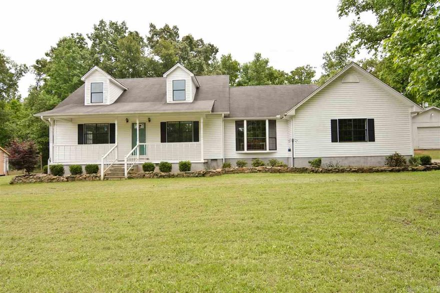 Ultimate country living on 5 beautiful acres, path through the woods beside running creek and natural springs. Fenced area for garden and  a home for chickens if desired. Enter home thru country front porch to gorgeous hardwoods on the first floor. Large kitchen & bay window, large laundry and master. 28 x 40 Workshop with floored attic with pellet stove.