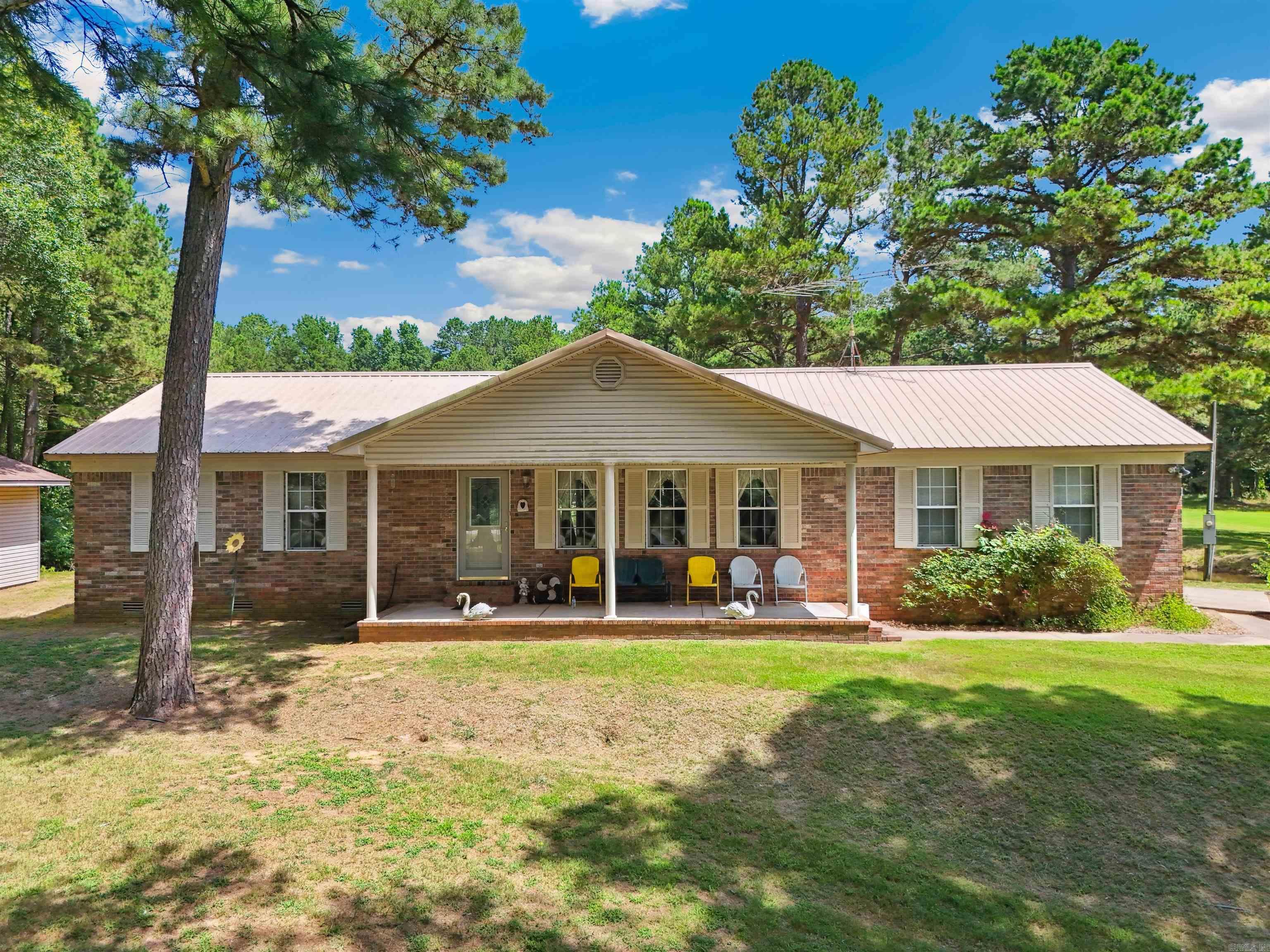 Discover tranquility with this well taken care of home nestled on 10 acres featuring 2 Large ponds, mature trees, and plenty of room to roam. The home is handicap accessible and thoughtfully designed for comfortable living. A large shop provides excellent space for hobbies or storage. BONUS: A small portion of the 10 acres is across the street, perfect for additional use. Enjoy the quiet of the countryside with room to grow explore and unwind. Working from home is no problem, Fiber Optic cable is available, just needs to be run to the house.