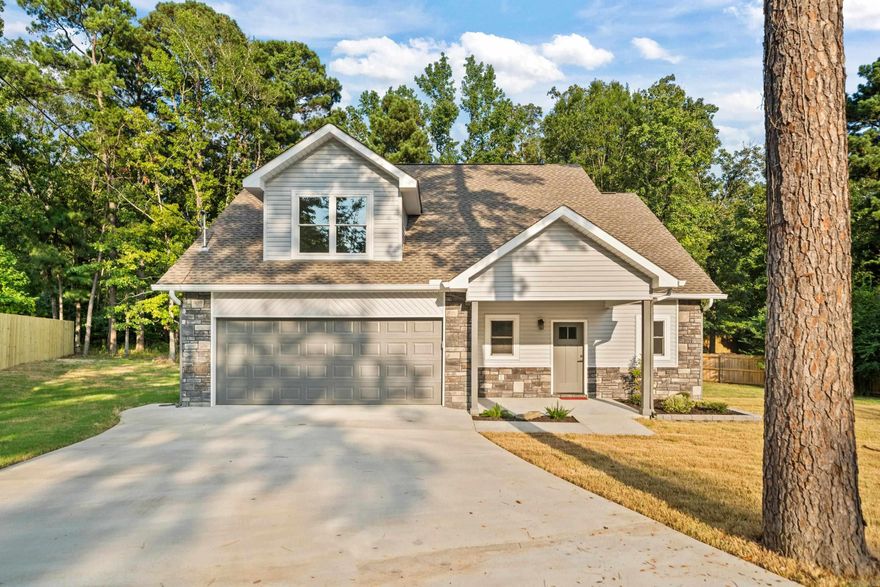 This beautifully crafted new construction residence offers 3 spacious bedrooms, 2 and a half bathrooms, and a thoughtfully designedopen-concept floor plan perfect for modern living. Step inside to discover an expansive living area that seamlessly connects the kitchen,dining, and family room—ideal for entertaining and everyday comfort. The heart of the home features stylish finishes, abundant naturallight, and luxury vinyl flooring throughout the main living spaces. The large primary en suite is conveniently located on the main level,offering a private retreat with a walk-in closet, dual vanities, and a custom-tiled walk-in shower. Secondary bedrooms are generouslysized and positioned for privacy, making this layout functional for families, guests, or home office needs. Enjoy year-round outdoor livingon the covered back patio, surrounded by mature trees that provide both beauty and privacy. Whether you're sipping your morningcoffee or hosting a weekend barbecue, the natural setting is sure to impress. Additional highlights include a two-car garage, and energy-efficient systems.This home combines the serenity of a wooded setting with the convenience of being minutes from Lake Hamilto