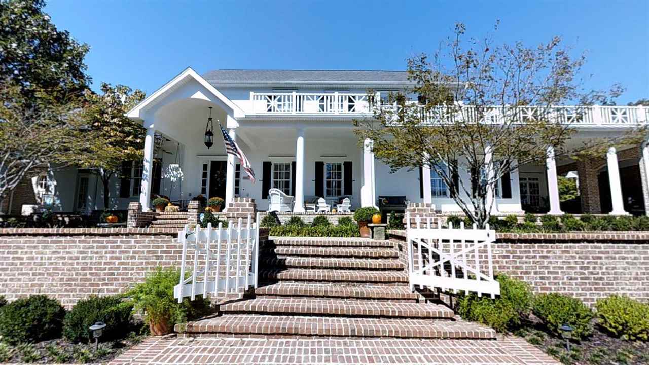 Custom built by Hambuchen Custom Homes. Fabulous home on 4 acres w/spectacular landscaped grounds. 1200 sf master suite & guest suite down. Chef's kitchen w/subzero refrigerator, marble counters, Double ovens. Lg. hearth room, formal living & dining, huge laundry, 2 BR w/private baths & lg. bonus room upstairs. Plantation shutters, 10 x 30 screened porch. Hardie Board, 2 FP (1 gas, 1 wood burning), 5" walnut floors, Peach Tree windows/doors, 3 car garage w/Porte Cochere. Garage apt. w/full bath.