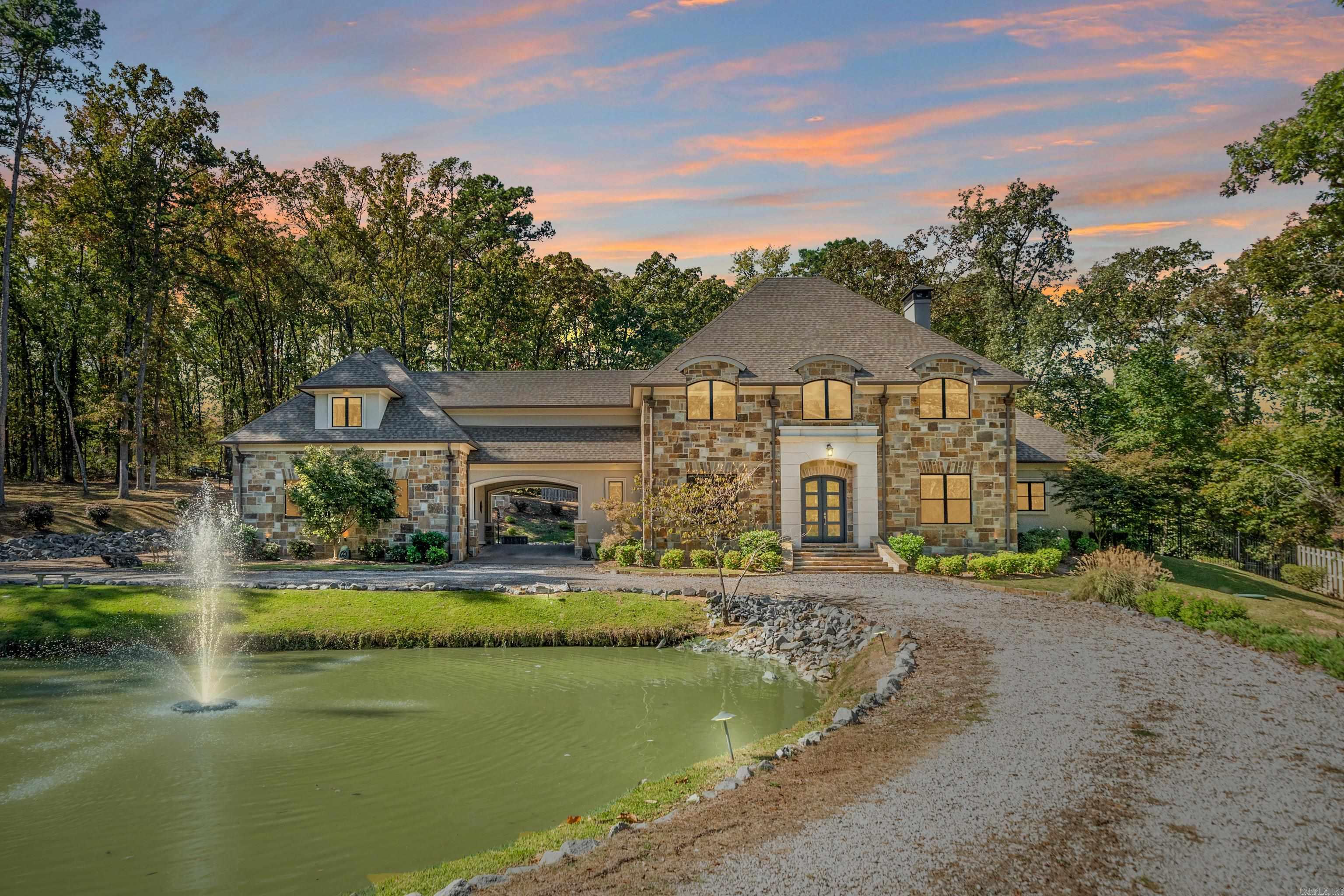 Refined Spaces, Relaxed Living!  Set within an exclusive gated cul-de-sac of just three homes, this estate-style property, on almost 3 acres, delivers privacy, sophistication and comfort in equal measure.  The main residence offers four bedrooms, three and a half baths, a dedicated office and plenty of flexible spaces including a media room and bonus room that easily adapt to your lifestyle.  Blending open space with thoughtful design and seamless flow, the kitchen brings ease to everyday living and energy to every gathering.  Step outside to the covered patio, where easy evenings by the fireplace meet the calming sound of the koi pond fountain.  A porte-cochere connects the main home to the guest quarters above the second garage.  With its own kitchenette, full bath, private bedroom and sitting area, itās perfect for visitors, extended family or an independent workspace.  From the gated entry to the peaceful surroundings, this property balances privacy, elegance, and livability in a way that feels both refined and refreshingly relaxed.