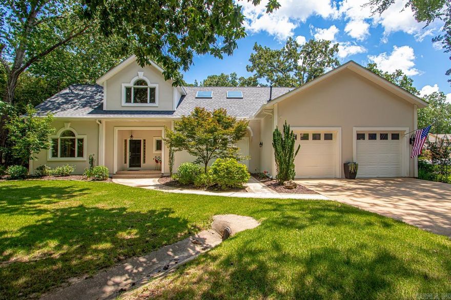 Welcome to your dream Lake Hamilton retreat in the Stonegate Shores gated community! This entertainer's paradise offers 800 sf of covered outdoor living space—complete with fireplace and outdoor kitchen—perfect for hosting year-round. It's just a short walk down to your private boat dock, where you can lounge on the boardwalk while enjoying main channel views or jump in the cove for a refreshing float!  With approximately 144 feet of mostly level shoreline, this one acre+ property is perfectly suited for lakefront living! Home Features: Expansive lake views from the main-level Living Room and Primary Suite, Double-sided fireplace, Spacious kitchen featuring granite countertops and abundant cabinetry! Upstairs includes three generously sized bedrooms and an open loft area ideal for a home office or lounge area! Additional detached 2 car garage/shop! New roof in 2024! Fully encapsulated crawl space is perfect for storage! Refrigerator, Washer & Dryer Convey! Community Amenities: Gated entry, Pool, Tennis Courts, Clubhouse, Trailer Storage Area! THIS ONE IS A MUST SEE!  Agents, see remarks!