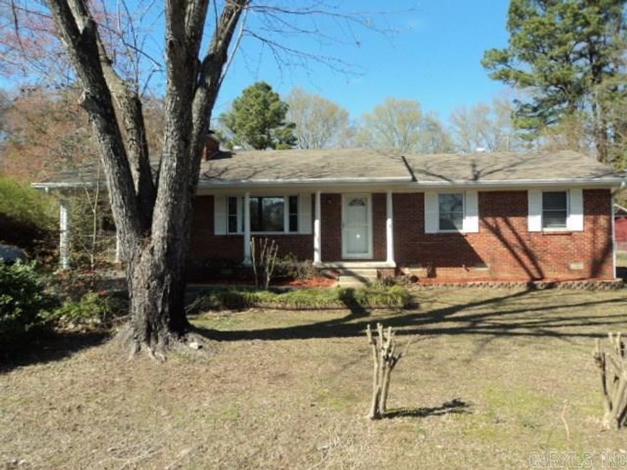 All brick home on large lot with two outside storage building/areas + great shop/office area. Huge deck and tons of extra landscaping. Home has been remodeled, bedroom & living room have rustic hickory hardwood (looks great). Totally repainted in neutral colors, fixtures updated, wood burning fireplace, new range, and water heater, very pretty home. Must see to appreciate.