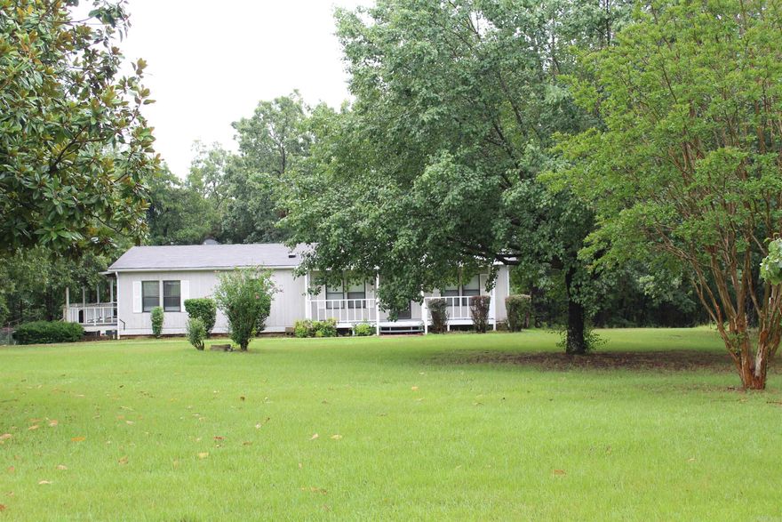 44 m/l acres, Hwy access, 1993 Doublewide mobile, 4800 square foot shop/warehouse building and only 5 miles to the 125 Marina on the Beautiful Bull Shoals Lake. The land is rolling woods with a few acres of level cleared land where the home sits. The home is well maintained, 3 bedrooms, 2 baths, private well  and septic. The large warehouse building offers lots of storage and a lower level that could be finished out for separate living space. This property has lots of possibilities or just come enjoy the close access to the lake and lots of woods to hunt and explore.