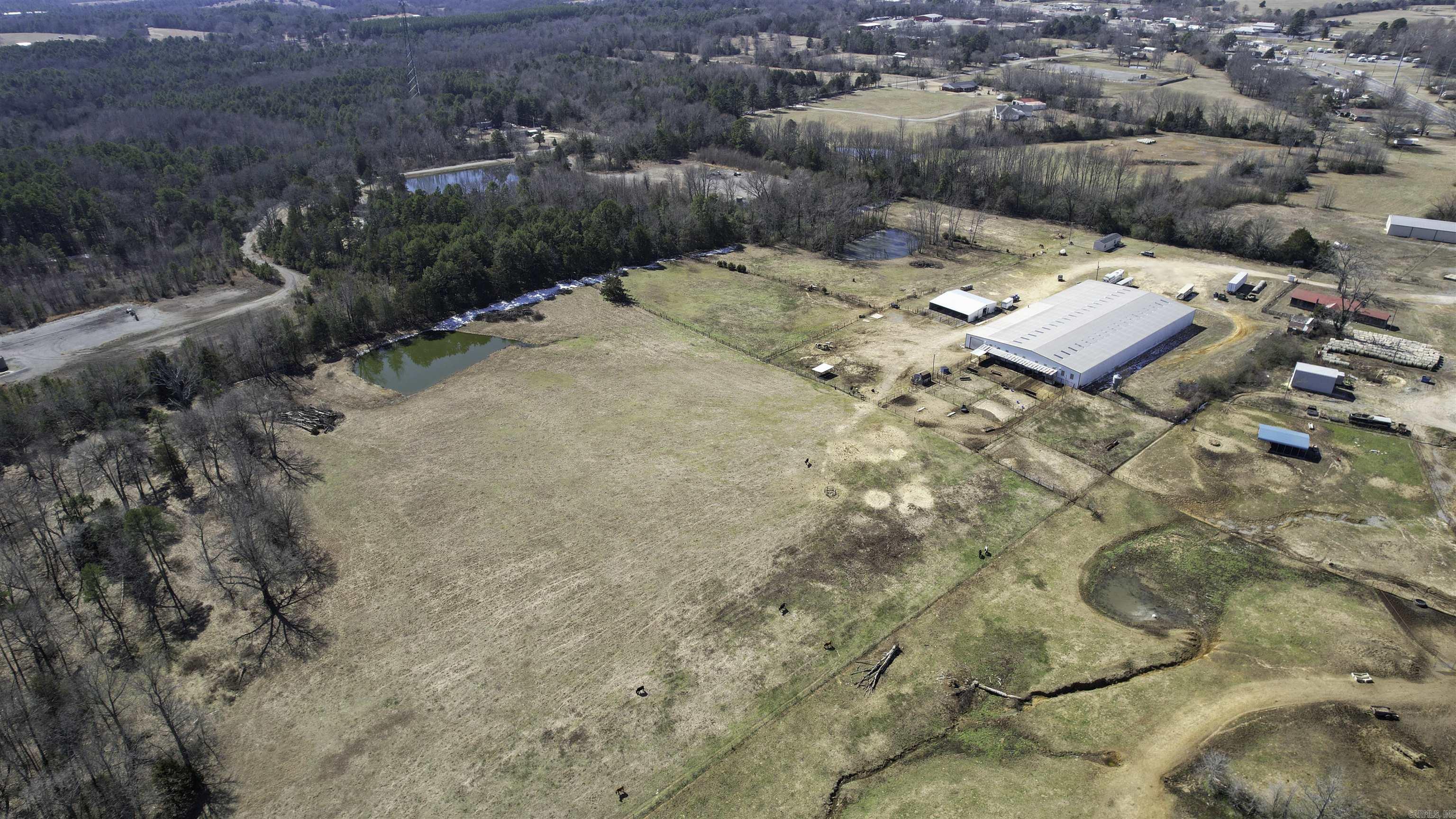 This property is an equestrian paradise. Complete with an indoor arena, multi-stalled barn with combination indoor/outdoor bays, spacious lots, sturdy working pens, and small home, this is the perfect property for the serious horseman who desires a turnkey equestrian complex.
