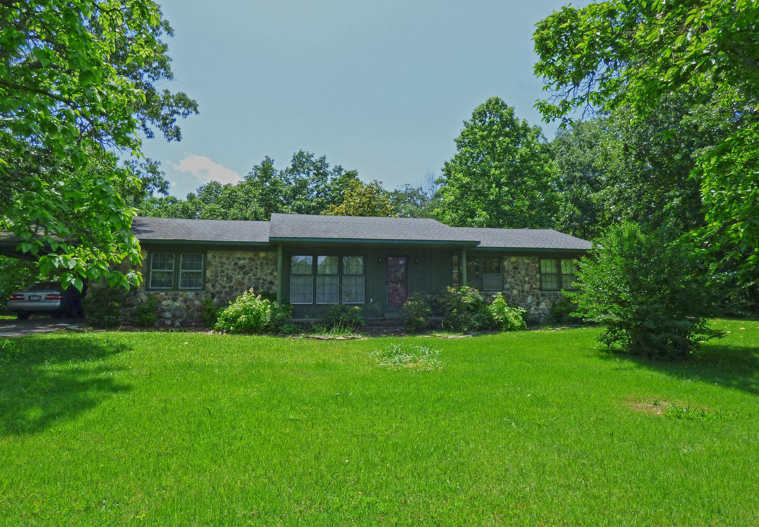 House on 3.5 Acres - This house has 3 bedrooms with hardwood floors, 2 baths, and over 1800 square feet of living space. Featuring a living room with a wood stove, nice sized kitchen, dining room, family or bonus room, and patio out back. The house sits back off Highway 63 on 3.5 beautiful acres.