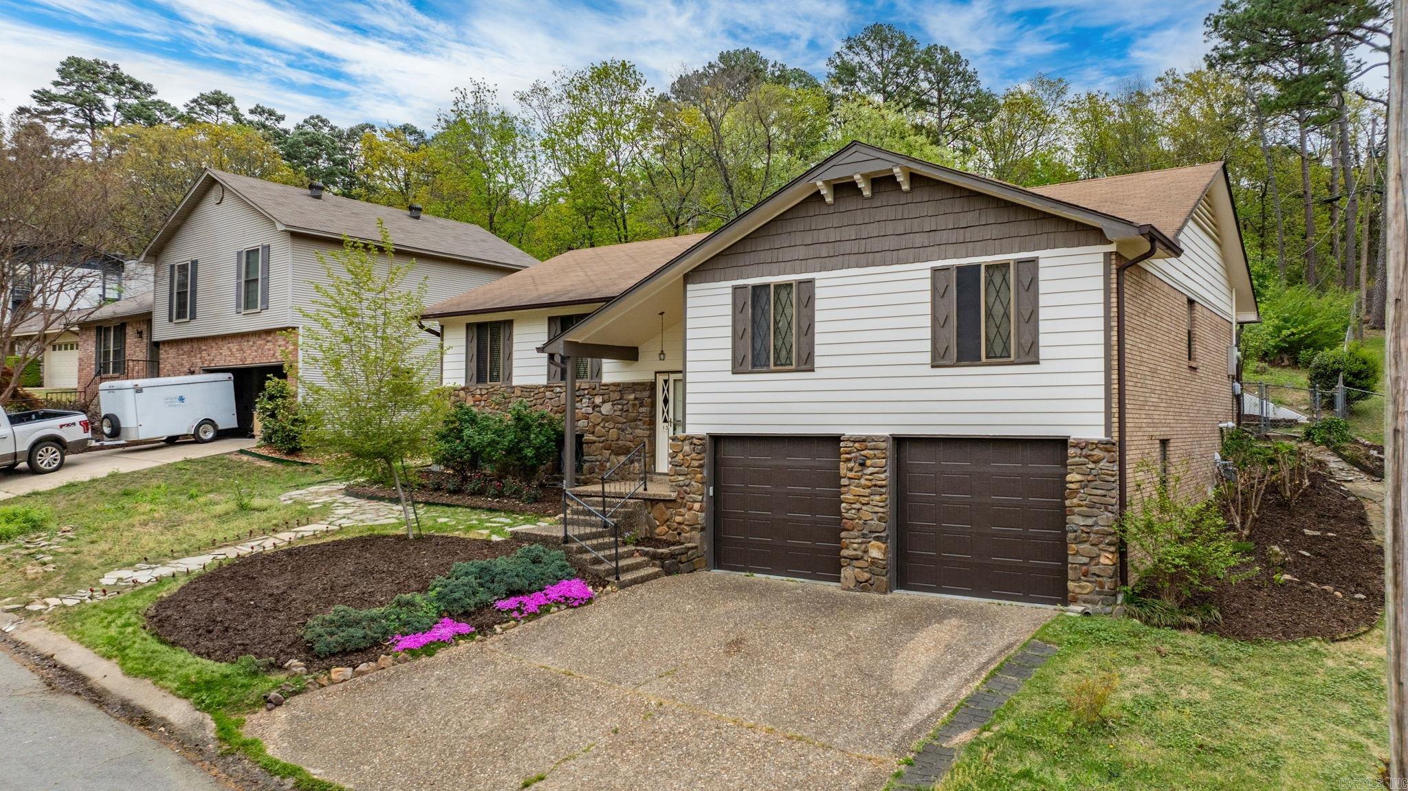 NEW ROOF- May 2025!!! Wonderfully updated split-level gem tucked away on a quiet cul-de-sac in the sought-after Echo Valley neighborhood of Little Rock. This 4-bedroom, 2-bathroom home offers a great layout with all bedrooms on the upper level. Downstairs, you’ll find a spacious second living area — perfect as a den, media room, playroom, or even an additional bedroom. The kitchen features ample cabinetry, an oversized eat-in island, and easy flow into the formal dining and main living areas. Set on a 0.45-acre lot, the fully fenced backyard offers a private retreat with fresh landscaping and plenty of space to enjoy. A new roof was just added May 2025! Echo Valley residents enjoy fantastic amenities like a swimming pool, two parks, tennis court, and shaded picnic areas — ideal for relaxing weekends and community connection. With its move-in-ready updates, flexible layout, and prime location near schools, shopping, and dining, this home delivers comfort, convenience, and lifestyle in one perfect package.