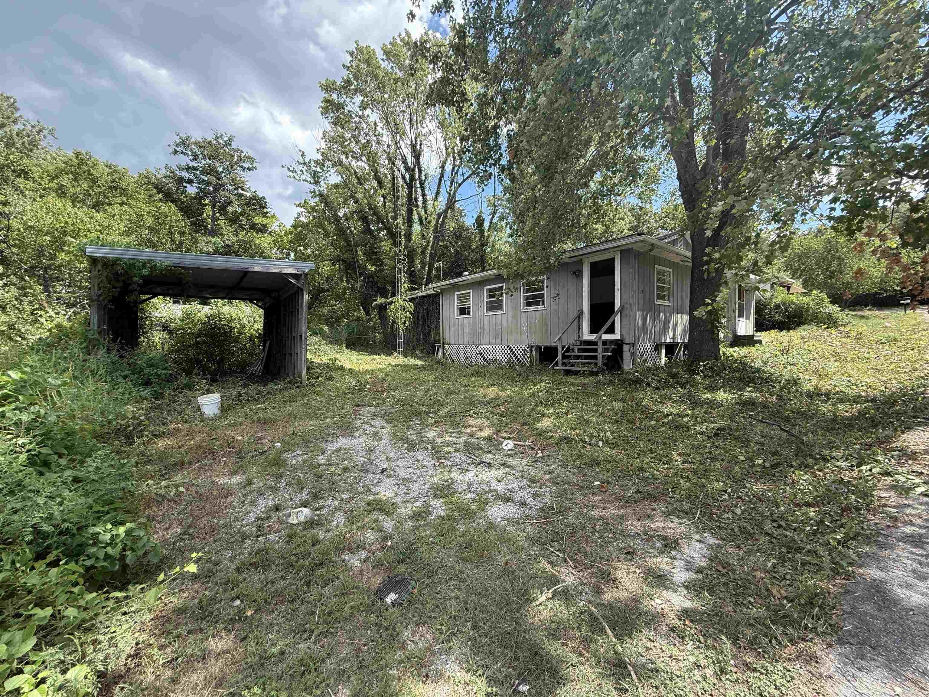 Opportunity knocks! This home sits on a spacious .73 acre lot right in town with city water and sewage already in place. The home is in need of significant renovation but offers tons of potential for the right buyer or investor. With its large lot size, central location, utility connections, and no restrictions, this is a rare chance to create value and bring new life to the property.