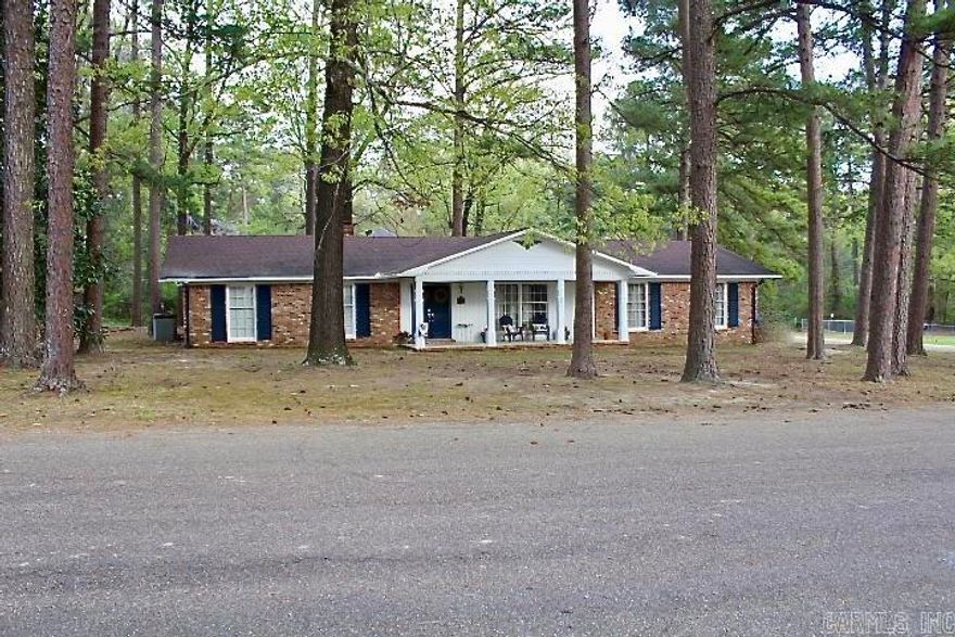 Come see this charming  home situated on a corner lot in one of Fordyce's most desired neighborhoods. This 3 bedroom, 2 bath home features an open kitchen equipped with granite countertops, stainless steel appliances and a spacious island that's perfect for dining, meal prep or simply hanging out. This open-concept kitchen allows you to choose whether the adjoining space with a fireplace serves as a dining area or cozy family room. French doors open into an additional flexible living space suitable for dining/family room, game room, music room or anything else you envision. This stunning home is nestled among tall pine trees and features a screened-in-porch where you can relax and savor the tranquility of the outdoors. These versatile spaces give you the freedom to create your own personal oasis and make it your own. Let me show you how easy it is to make this YOUR new place to call HOME!