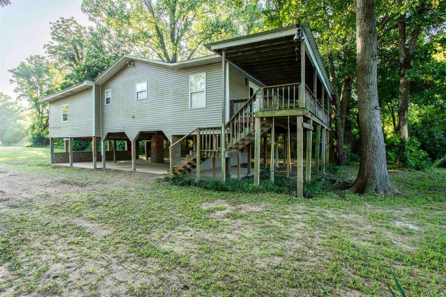 Riverfront Cabin with Endless Potential – Hardy, AR  Discover the beauty and tranquility of the Ozark foothills with this 3-bedroom, 2-bathroom riverfront cabin, located just southeast of Hardy, Arkansas. With 1,540 sq ft of living space on 0.85 acres, this property offers a rare opportunity to own a piece of riverfront paradise.  The cabin features a spacious layout and sits just steps from the riverbank, offering peaceful views and direct access to the water—perfect for fishing, kayaking, or simply relaxing in nature. The property is equipped with a private well and septic system.  While the home needs some TLC, it provides a solid foundation for renovation, making it ideal for investors, DIY enthusiasts, or anyone seeking a quiet getaway to customize to their taste.  Property Highlights:    3 Bedrooms / 2 Bathrooms 1,540 Sq Ft 0.85-acre riverfront lot Located in the scenic Ozark foothills Well and septic in place Needs updates—great investment potential  Whether you’re looking for a vacation retreat, rental opportunity, or a full-time residence with river views, this hidden gem is full of potential. HVAC NOT FUNCTIONAL, has a window unit.  Bring your vision and make it your own!