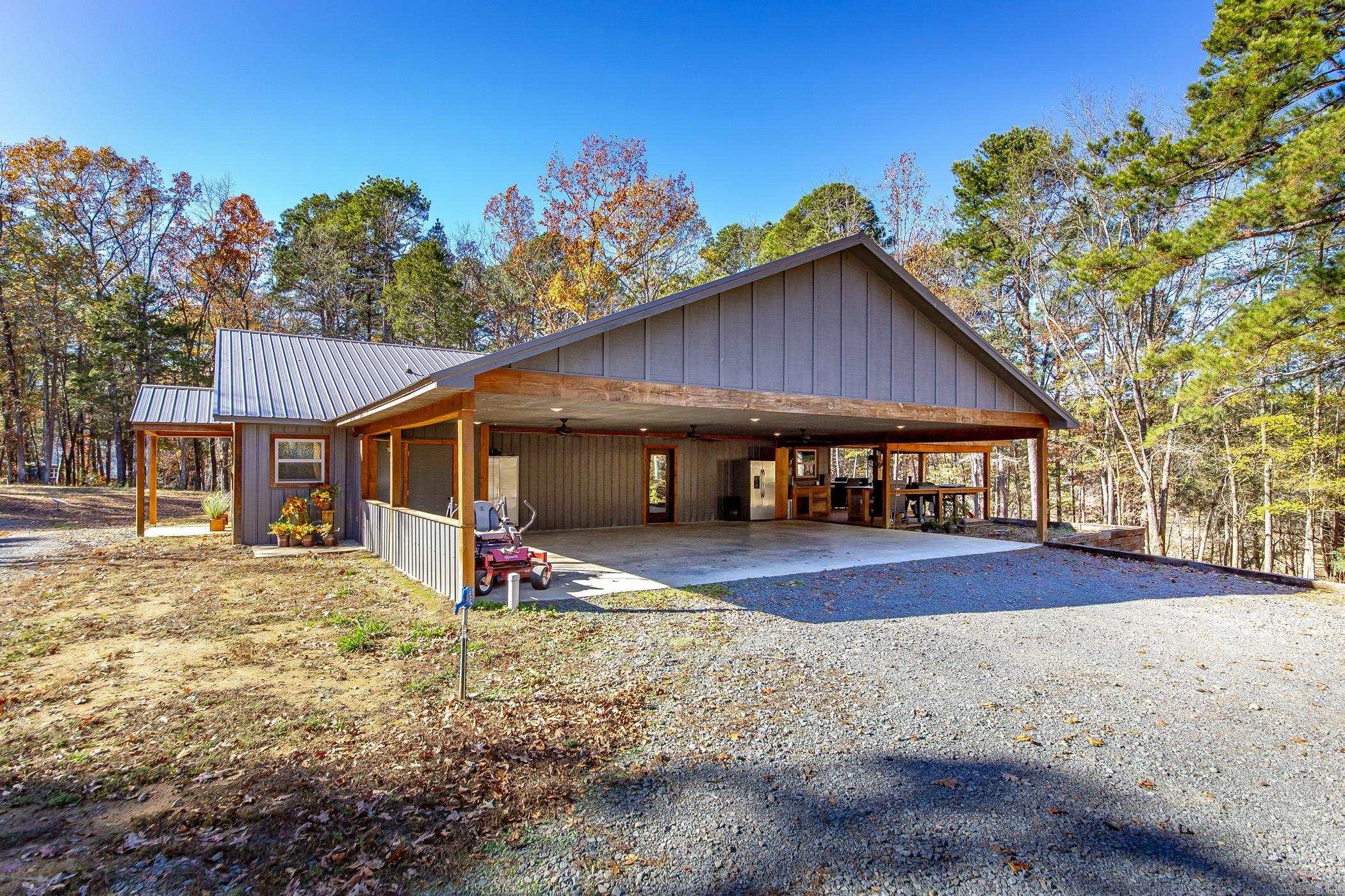 LAKEFRONT dream home!!! It has a private boat dock with two slips! Escape to your own very private paradise on 2.12 acres. Very unique home. Open floor plan. 3 bedrooms and 2 baths. Comfortable deck over looking the lake. Nice outdoor cooking area. Plenty of room for all your guest! Mostly Furnished Lakehouse. Low maintenance. Just bring your clothes and enjoy life!!!!!!