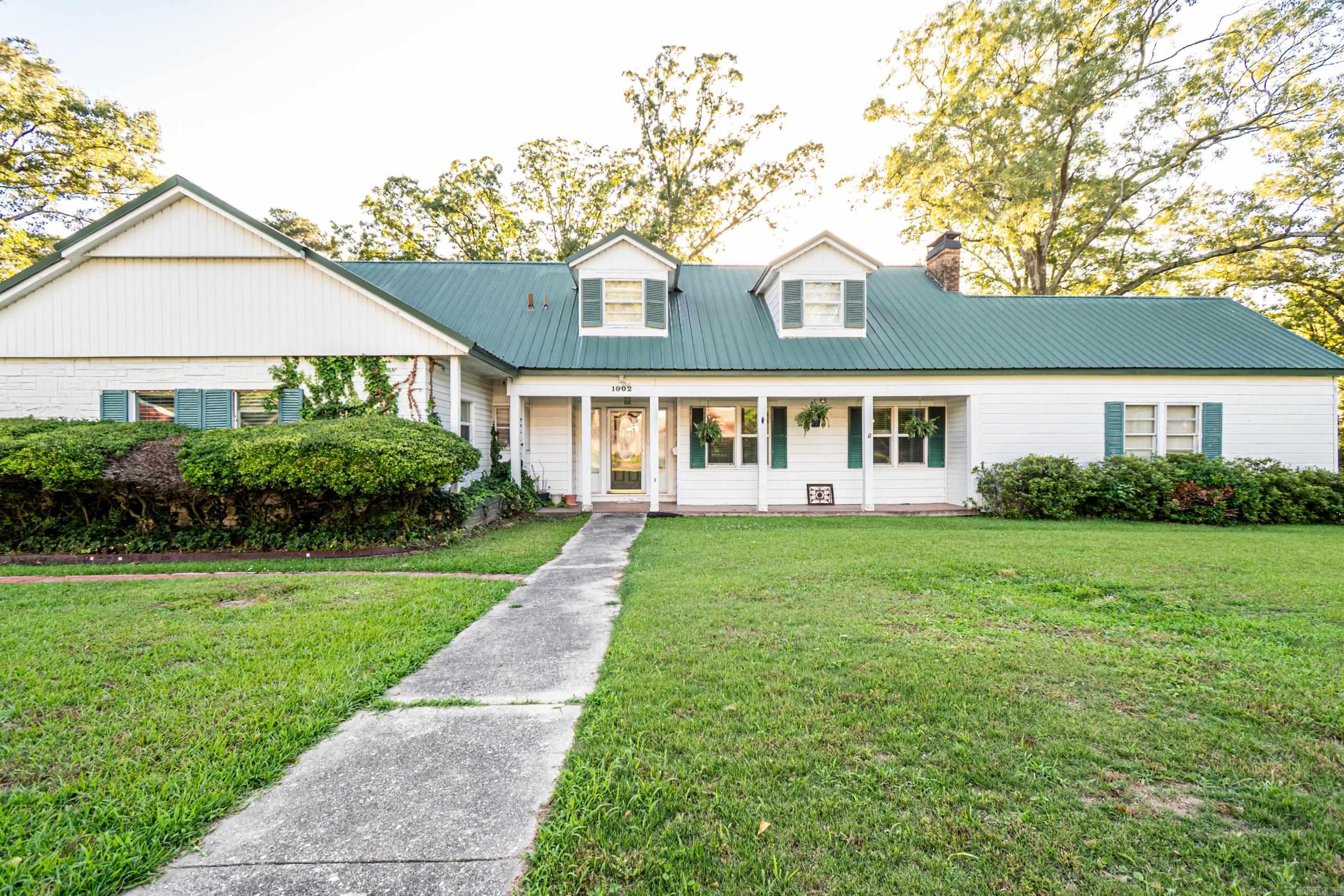 Charming 4-Bedroom Home on Over Half an Acre! Welcome to 1002 N. Bradley — a spacious 4 bedroom, 3 bath home full of character and charm. Situated on just over half an acre, this property features fresh paint, new flooring, a new roof, and an updated HVAC system. Gorgeous hardwood floors and a generous layout offer plenty of space to spread out. With its solid updates and room to personalize, this home is ready for your finishing touch.