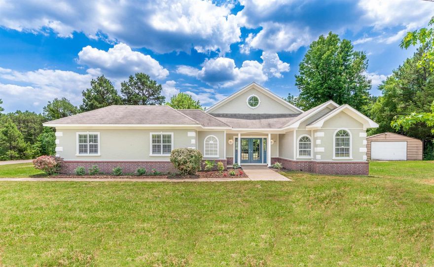 This home has been recently remodeled and has that NEW HOME SMELL.  Imagine entertaining family and friends in this terrific main room which swells unto the massive rear deck.  Cither bathroom (one is a walk in tub).  Bonus room would make a great TV Room or even a fourth Bedroom.   Are you a handy person, you may want to plan to spend a lot time in the oversized two car garage or the separate concreted floor shop. School Choice could apply with nearby Southside and Greenbrier Schools  Surrounded by mature pines roads, don't miss the great pinic area. Also Don't miss the open area (Is there room for a horse or two? ) Check it out!