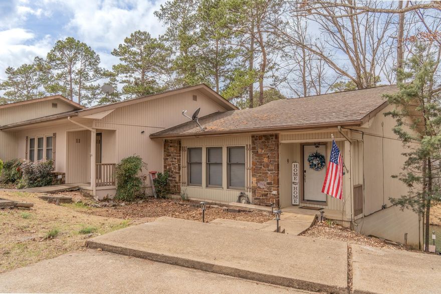 Wake up to stunning WATERFRONT views on beautiful Lake DeSoto! This fully furnished 3-bedroom END-UNIT townhome offers the perfect mix of relaxation, recreation, and income potential with a proven successful short-term rental history. Enjoy incredible sunsets from your private back deck or lower patio, or walk down to your own boat/swim dock and head straight onto the lake. The sale even includes two kayaks with all the gear, making it a truly turnkey lake getaway. Inside you'll find an updated kitchen with granite countertops and new appliances, perfect for entertaining after a day on the water. New LVP flooring in the living room. The main-level also includes the primary bedroom with deck access and a full bath, while the lower level offers two additional bedrooms and full bath—ideal for family or guests. An oversized laundry/storage/owner’s room provides space for personal belongings while maximizing rental potential. The home is fully equipped for vacation rentals, including extra linens, dishes, silverware, cookware, and everything needed for guests, allowing income from day one. Hot Springs Village has a $2000 new owner buy-in fee.