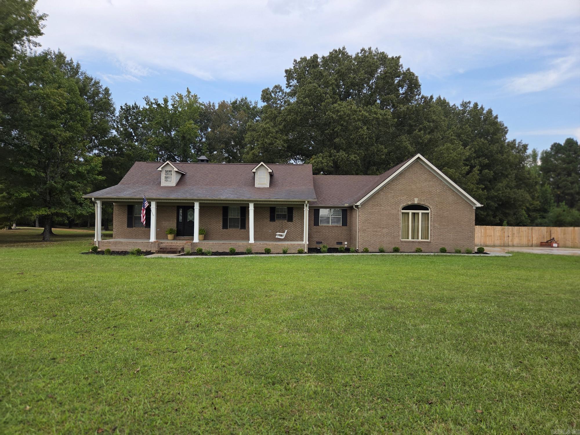 Nice updated 3 bedroom, 2 bath house with long double driveway, 2 car garage, new privacy fence, new large deck, new 12x24 storage building on 3 acres just a few miles from city limits of Searcy. This house was recently remodeled with a new stainless appliances including a top end double oven & refrigerator. Kitchen has quartz countertops, new sink & faucet, pantry, desk nook & new tile floors. Living room has vaulted ceilings with accent lights, French doors & a wood fireplace with new laminate flooring in living room, hall & foyer. The primary bedroom has a seating area & door to the patio with double closets & attached bathroom. The property goes way back into trees, so only mow what you want to & ride ATV's or hunt the rest. Appointment only, see agent remarks.